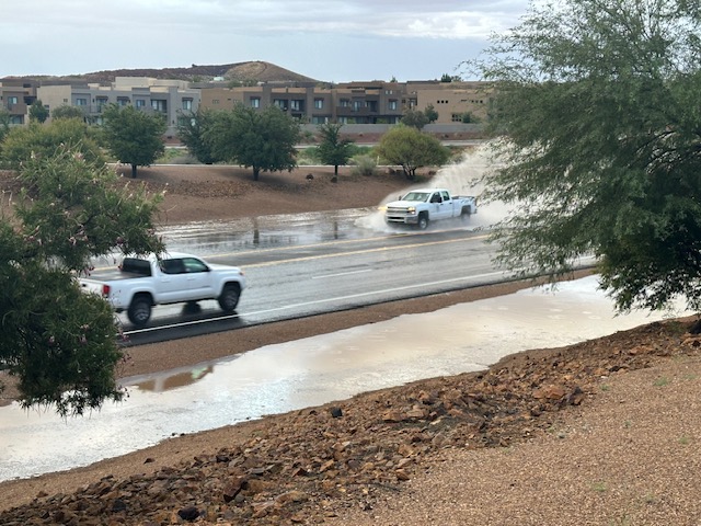 Flash flooding along state Route 18 by the Ledges golf course in St. George, which received over 2 inches of rain Thursday morning. Water managers in southwest Utah are asking residents to stop outdoor watering to capitalize on the rainfall. 