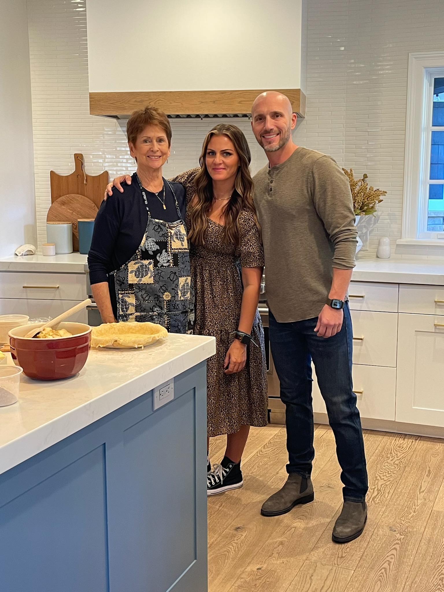 Nancy Whitney, left, poses for a picture with her daughter Chrisi Hammer, middle, and Hammer's husband. Started long ago in a family kitchen in Utah, Sunshine Buns on Friday opened its first brick and mortar location in Orem.