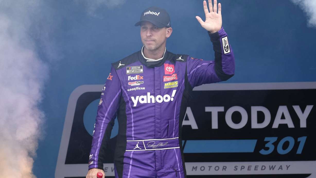 FILE - Denny Hamlin is introduced before a NASCAR Cup Series race, Sunday, June 23, 2024, at New Hampshire Motor Speedway, in Loudon, N.H.