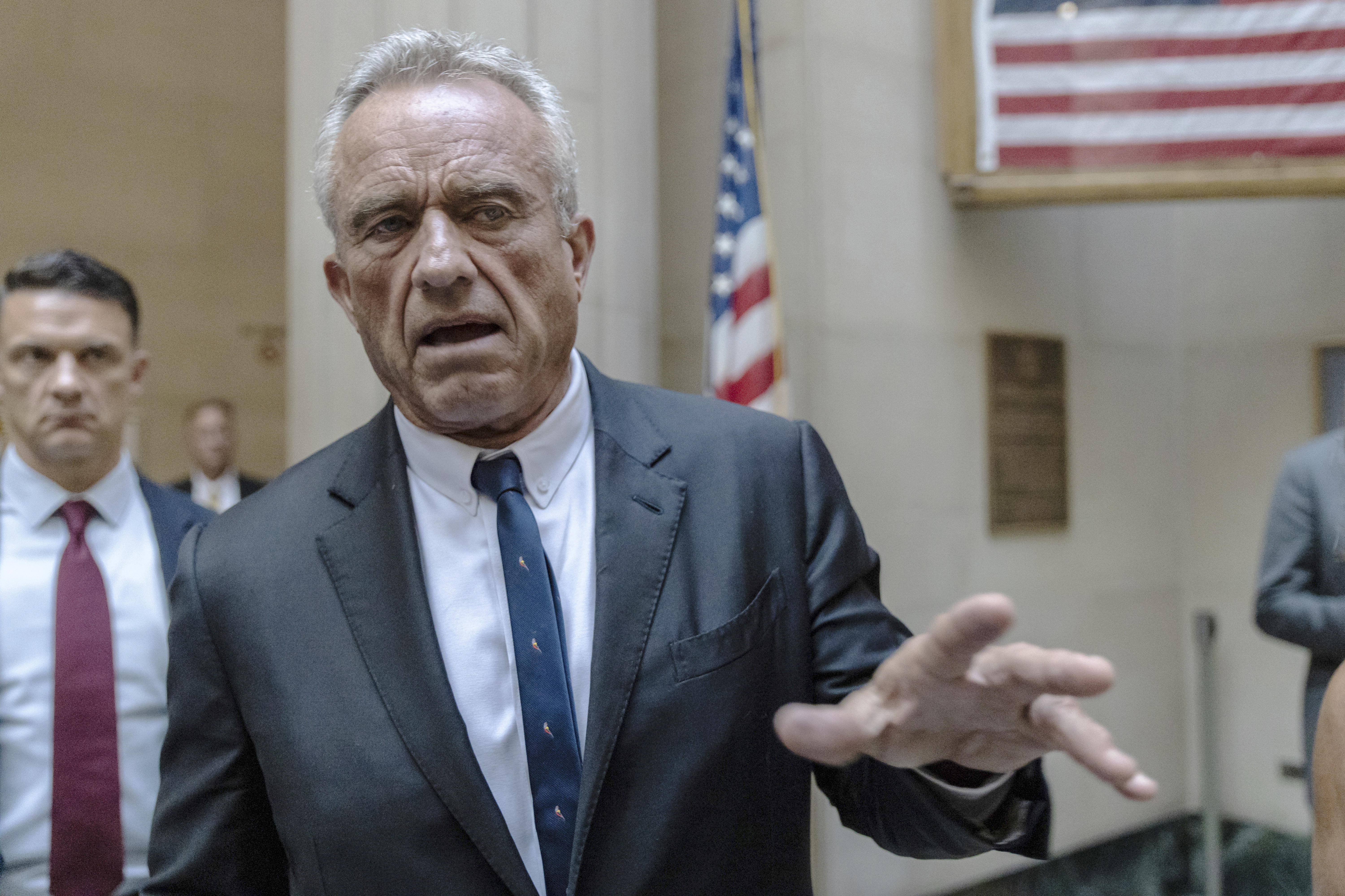 Independent Presidential candidate Robert F. Kennedy Jr. speaks to reporters at the Nassau County Supreme Court in Mineola, N.Y. on Wednesday. He says he's suspending his presidential bid and backing Donald Trump.