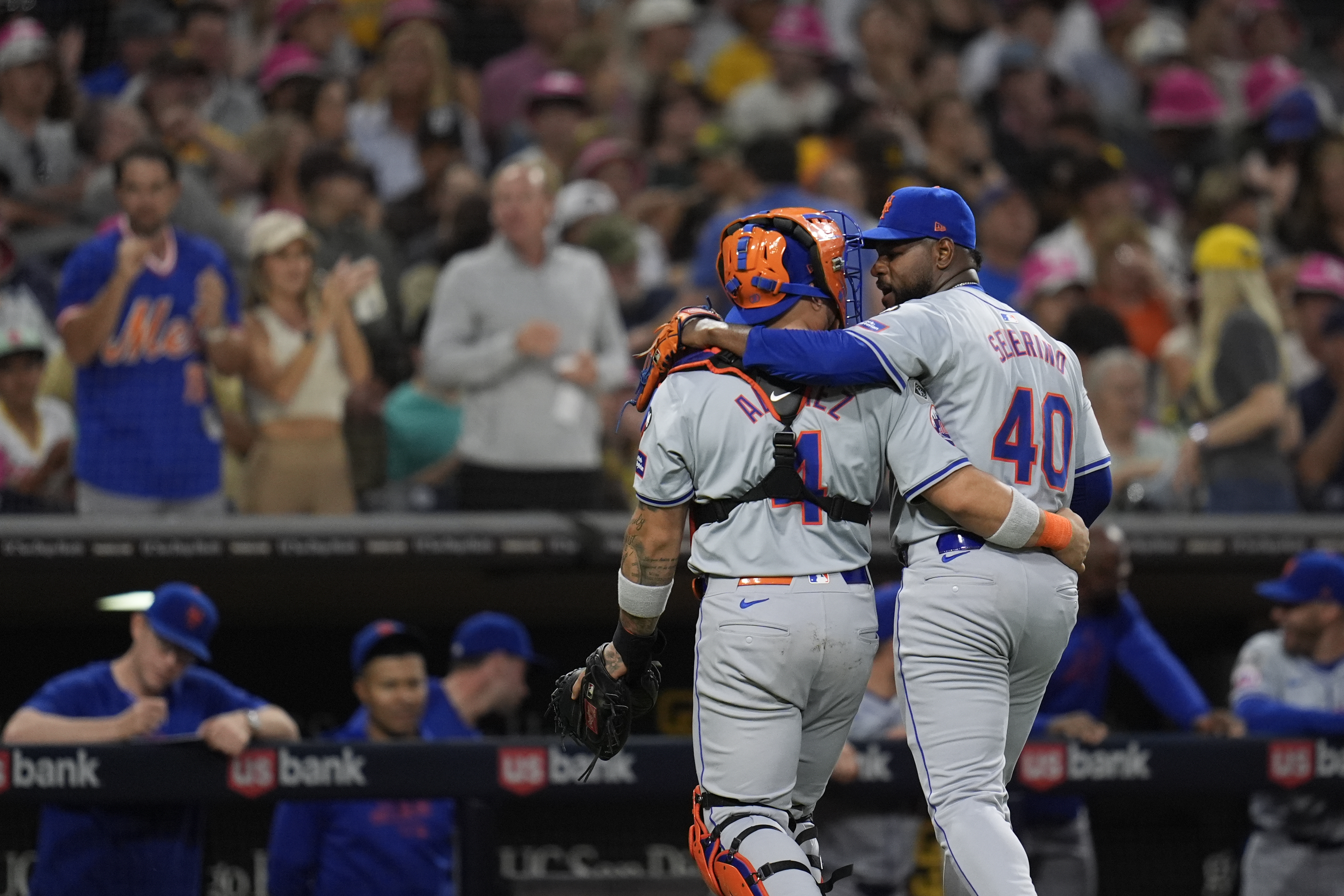 New York Mets starting pitcher Luis Severino, right, talks with catcher Francisco Alvarez as they walk back to the dugout at the end of the third inning of a baseball game against the San Diego Padres, Thursday, Aug. 22, 2024, in San Diego. 