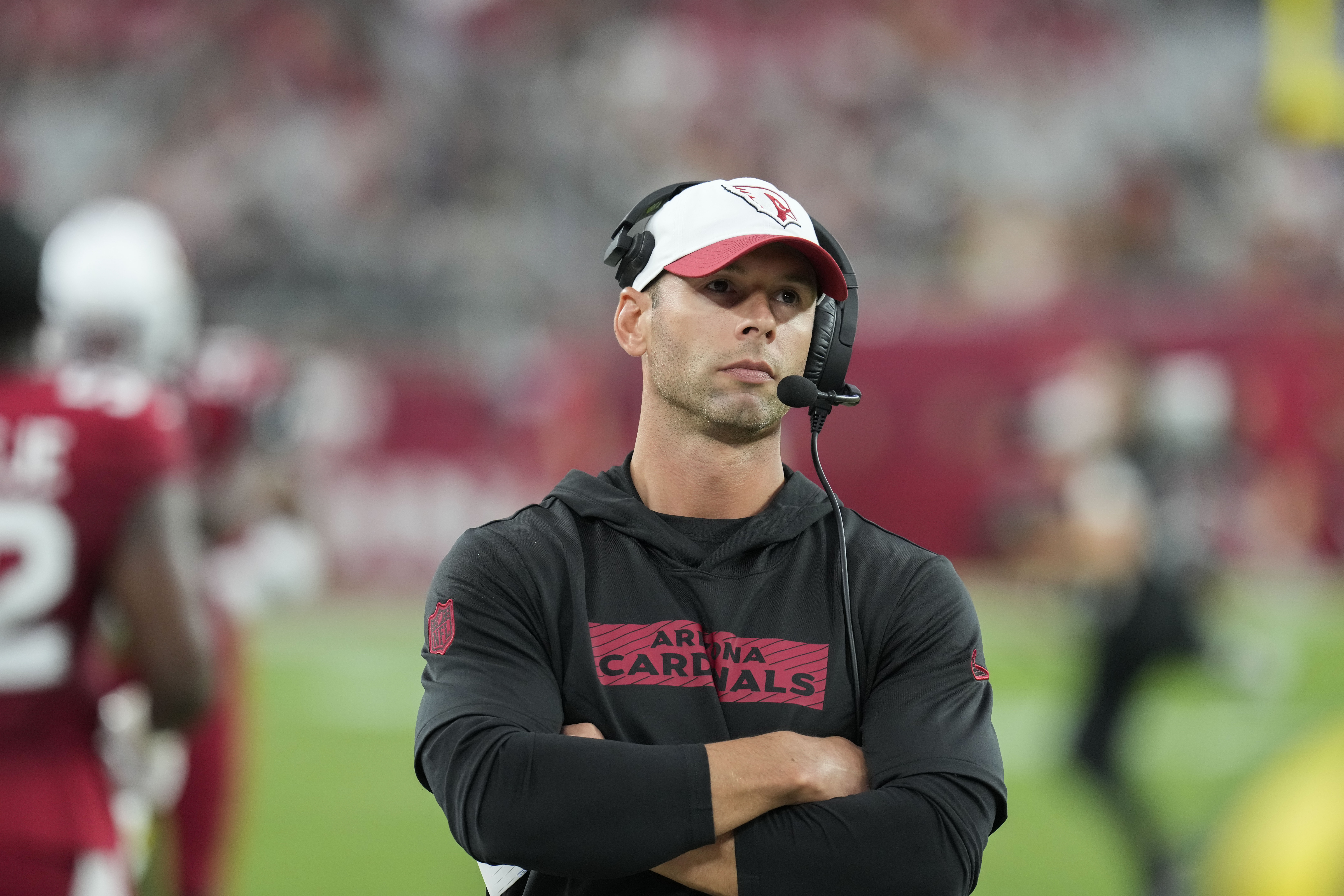 Arizona Cardinals head coach Jonathan Gannon walks on the field before a preseason NFL football game against the New Orleans Saints, Saturday, Aug. 10, 2024, in Glendale, Ariz.