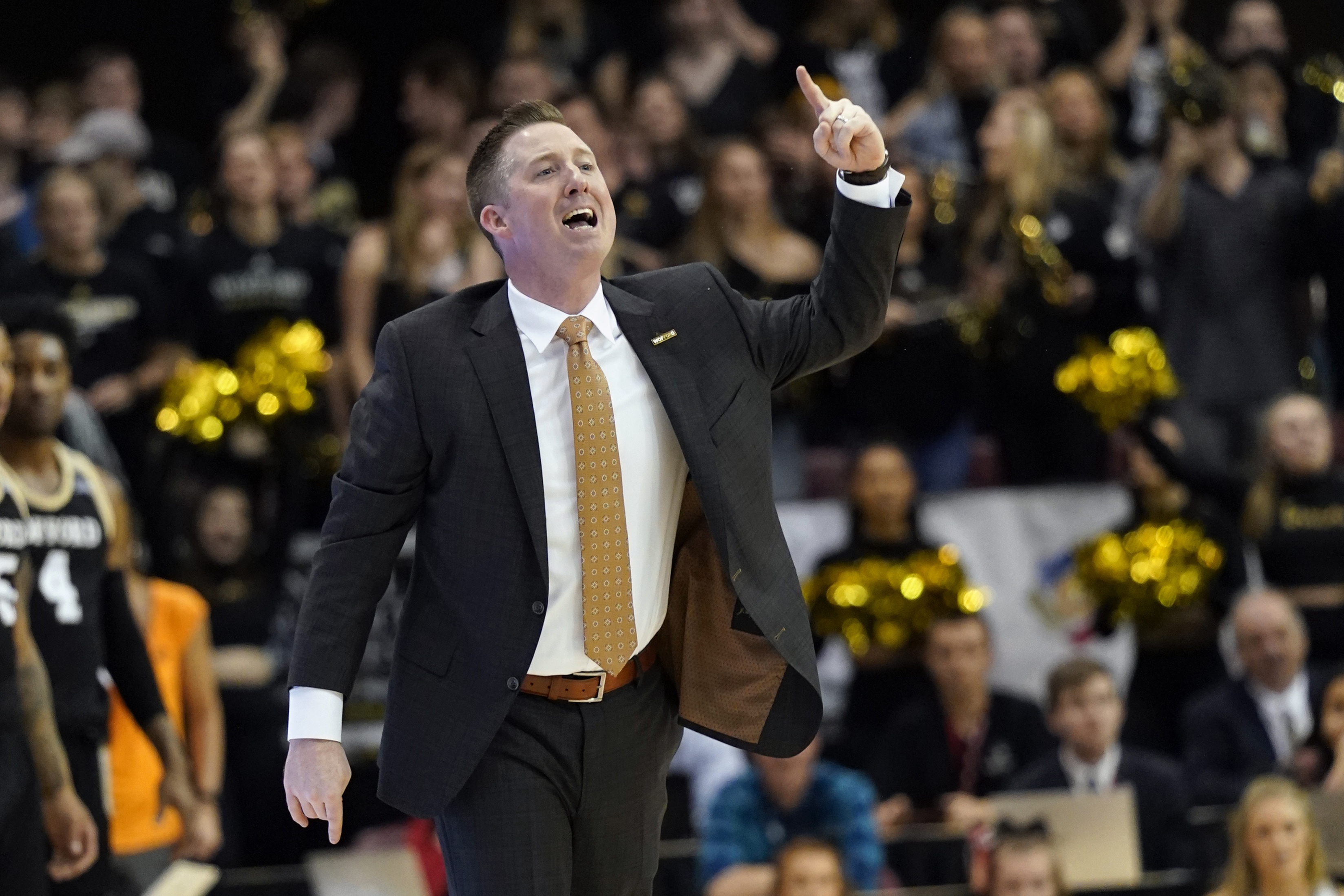 FILE - Wofford head coach Jay McAuley directs his team against East Tennessee State during an NCAA men's college basketball championship game for the Southern Conference tournament, Monday, March 9, 2020, in Asheville, N.C. 
