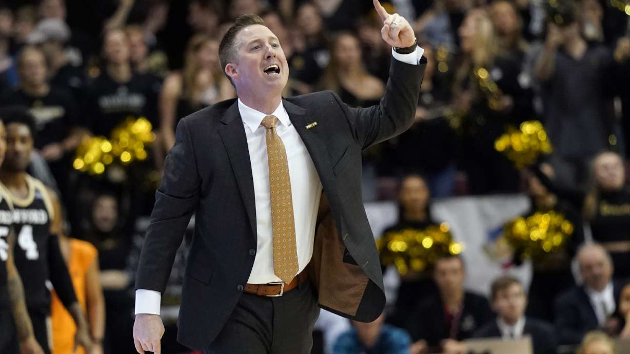 FILE - Wofford head coach Jay McAuley directs his team against East Tennessee State during an NCAA men's college basketball championship game for the Southern Conference tournament, Monday, March 9, 2020, in Asheville, N.C.