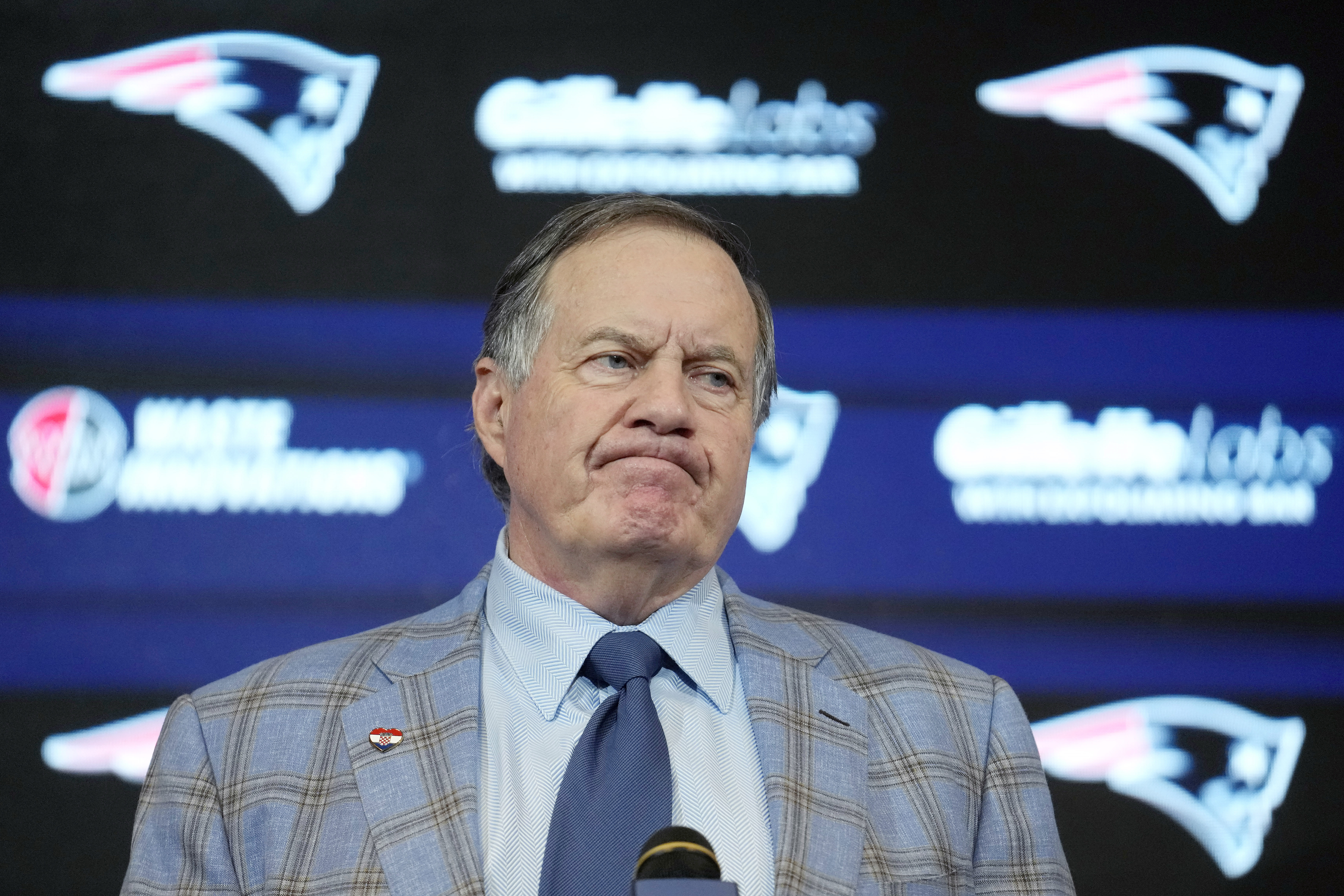 FILE - Former New England Patriots head coach Bill Belichick faces reporters during an NFL football news conference, Jan. 11, 2024, in Foxborough, Mass..