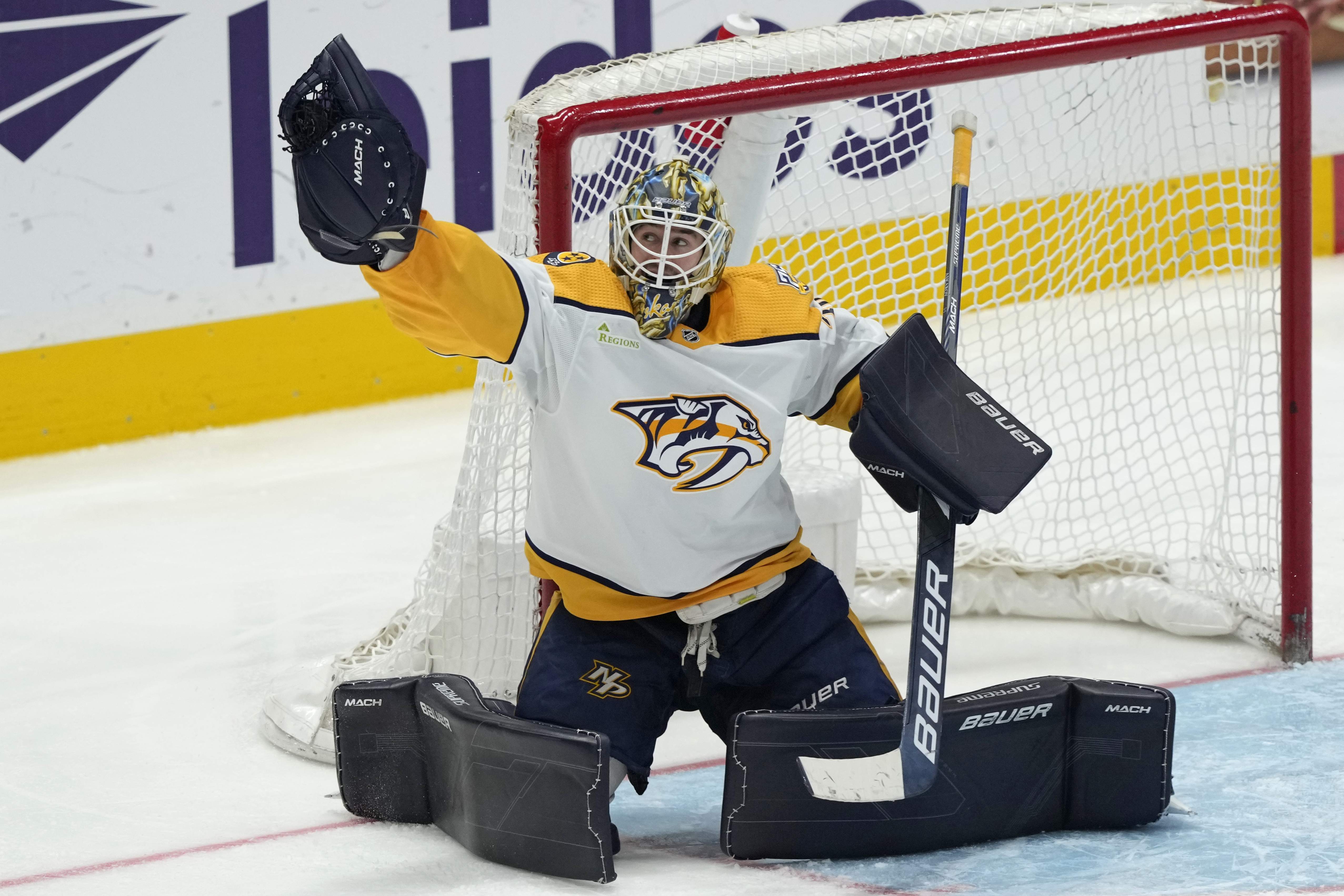 FILE - Nashville Predators goaltender Yaroslav Askarov grabs a shot by the Washington Capitals during the third period of an NHL hockey game in Washington, Dec. 30, 2023.