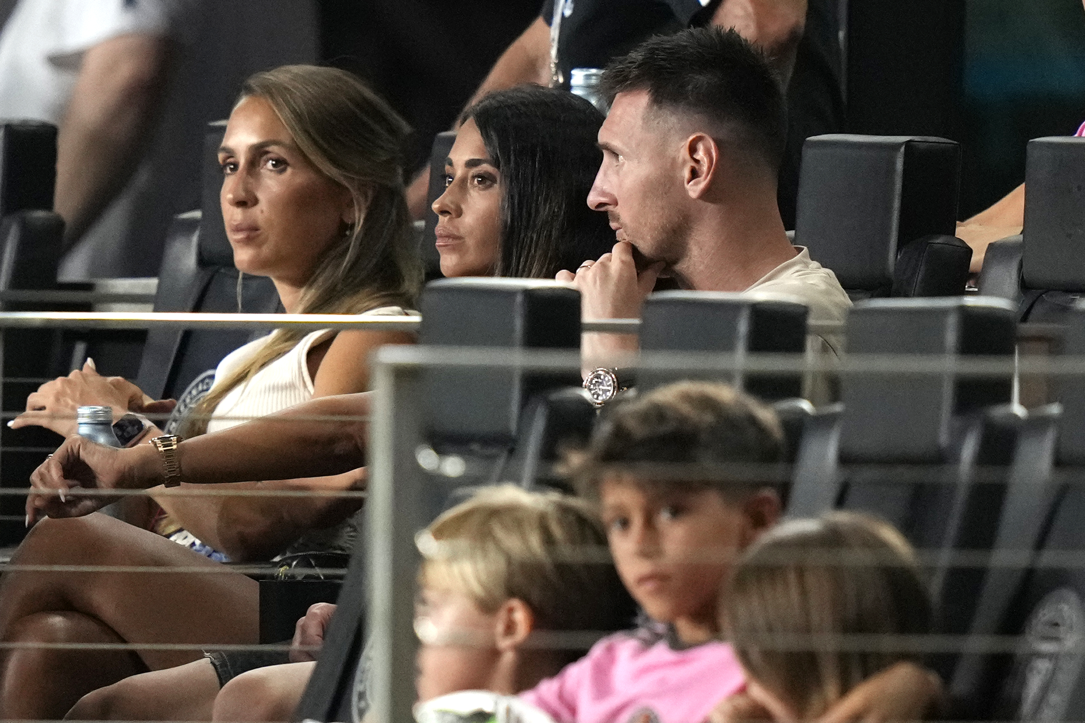 Inter Miami forward Lionel Messi, top right, sits with his wife Antonela Roccuzzo, second from left, during the second half of a Leagues Cup soccer match against Puebla, Saturday, July 27, 2024, in Fort Lauderdale, Fla. Messi did not play due to an ankle injury. 