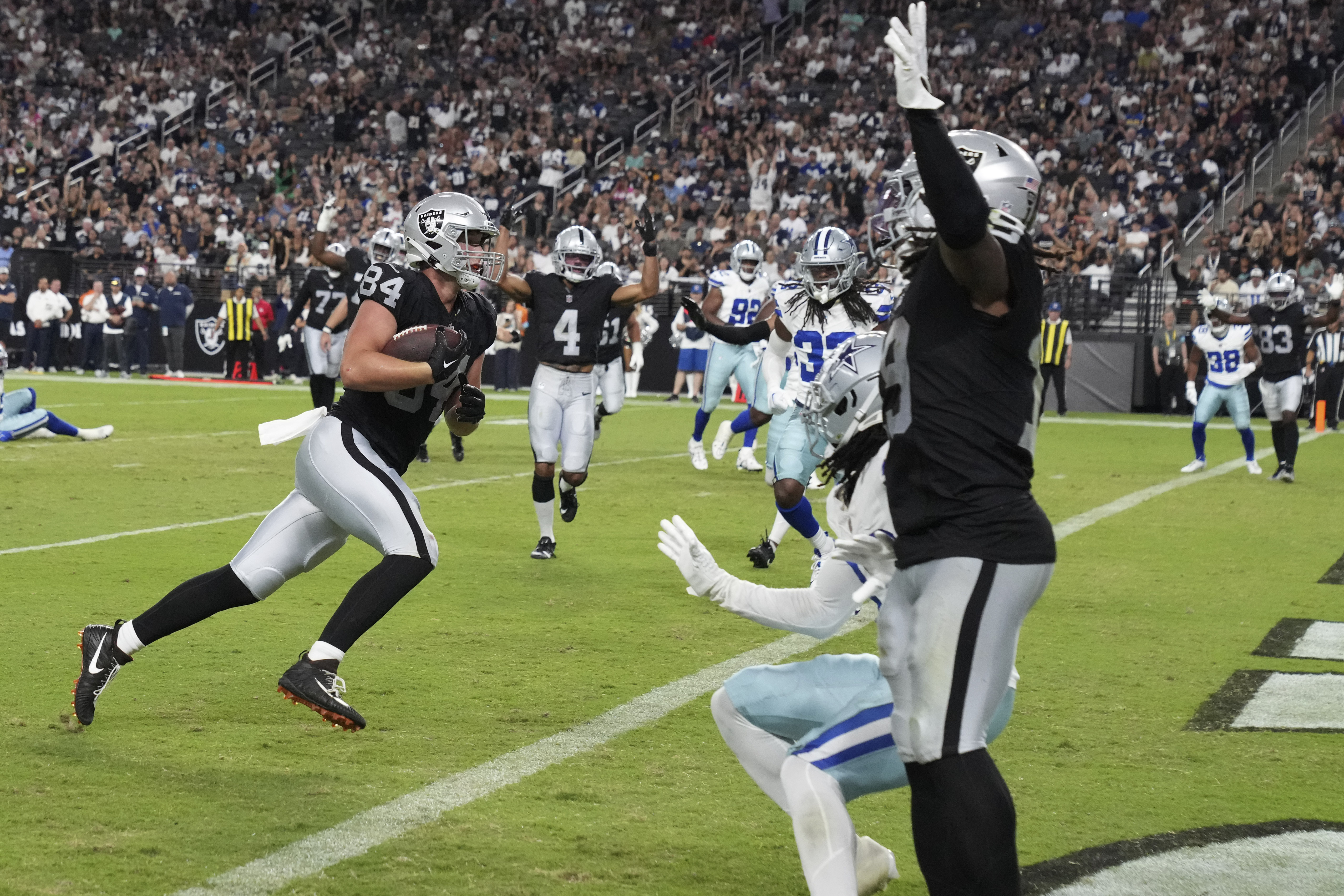 Las Vegas Raiders tight end Harrison Bryant (84) scores a touchdown against the Dallas Cowboys during the second half of an NFL preseason football game, Saturday, Aug. 17, 2024, in Las Vegas. 
