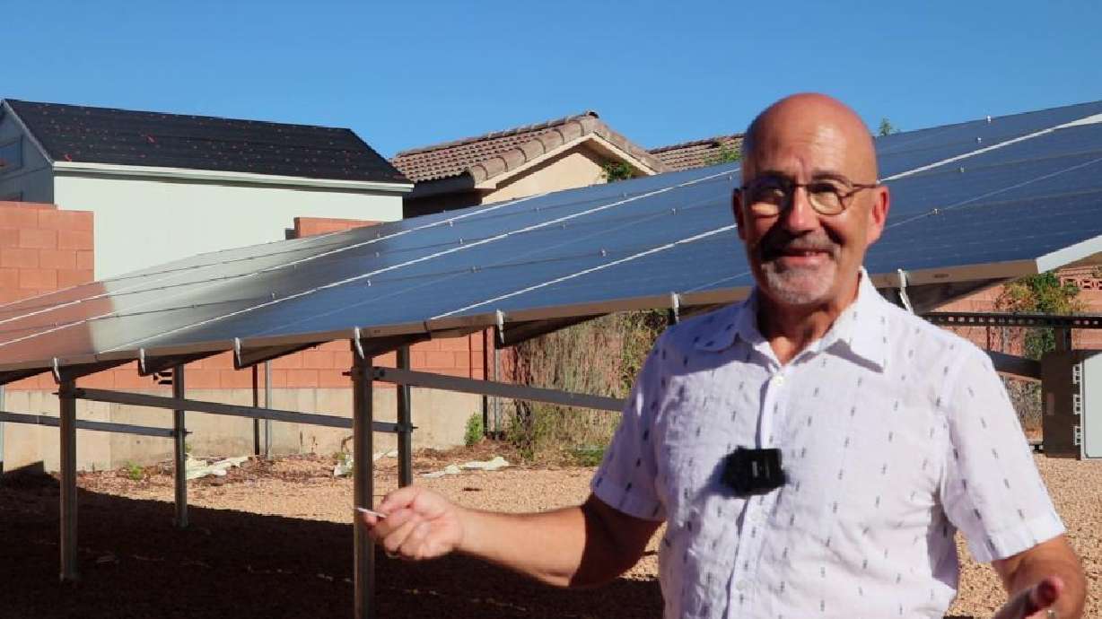 The Rev. Dr. Ralph Clingan talks about the solar panels installed behind the Good Shepherd Presbyterian Church that are a part of a small solar farm behind the church, St. George, Aug. 15.