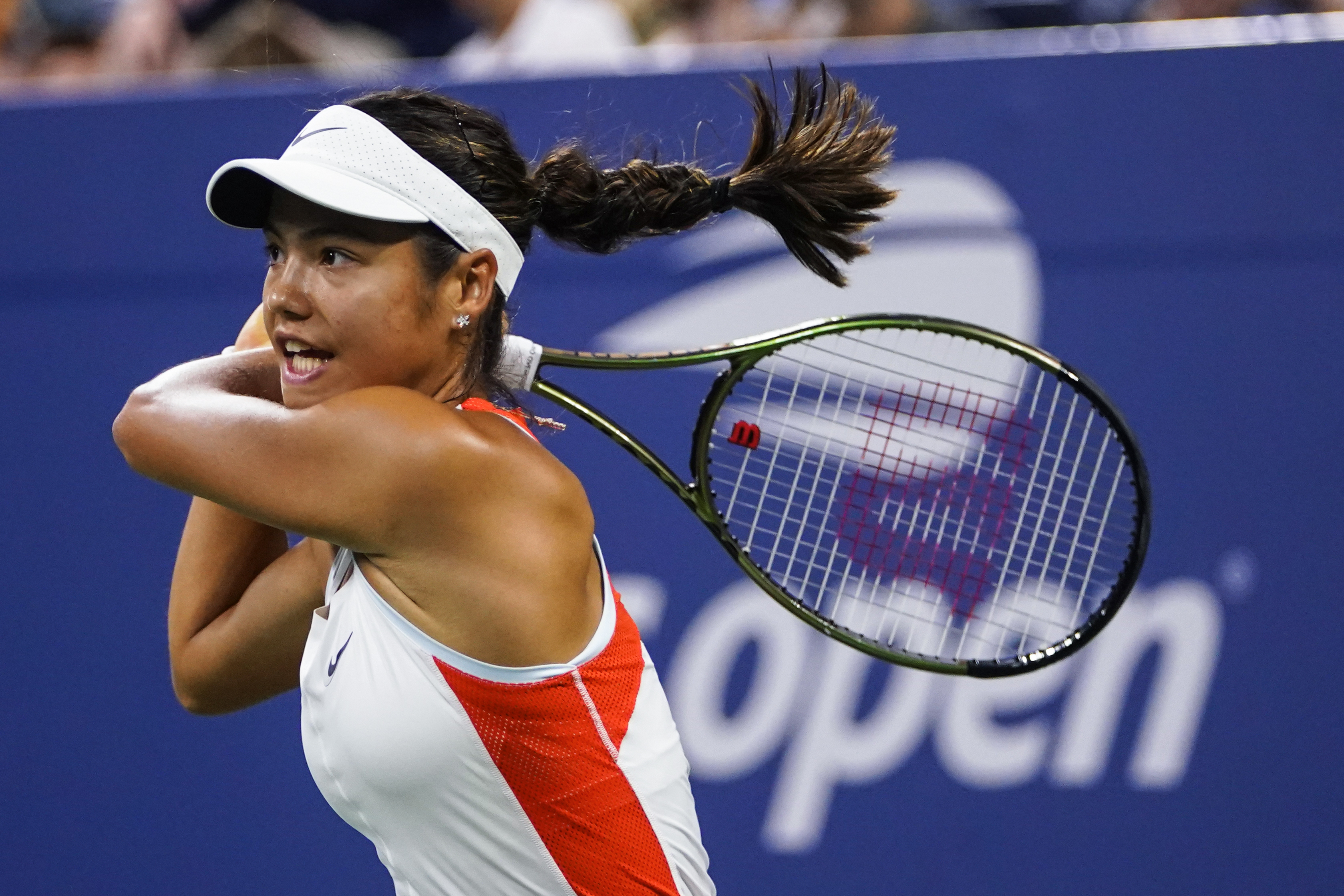 FILE - Emma Raducanu, of Britain, returns a shot to Alize Cornet, of France, during the first round of the US Open tennis championships, Aug. 30, 2022, in New York. 