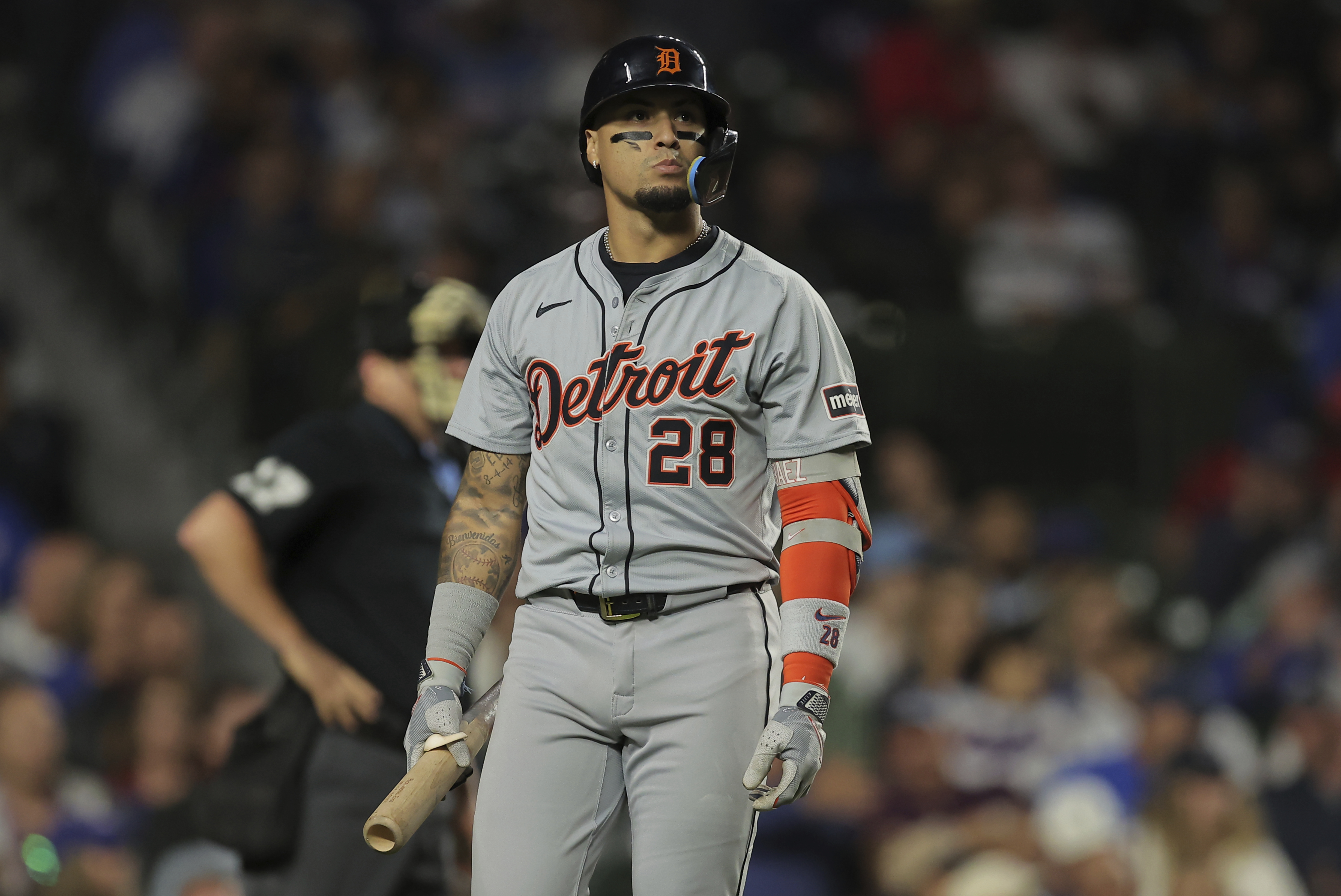 Detroit Tigers' Javier Báez walks back to the dugout after striking out for the third time during the seventh inning of a baseball game against the Chicago Cubs Tuesday, Aug. 20, 2024, in Chicago. 