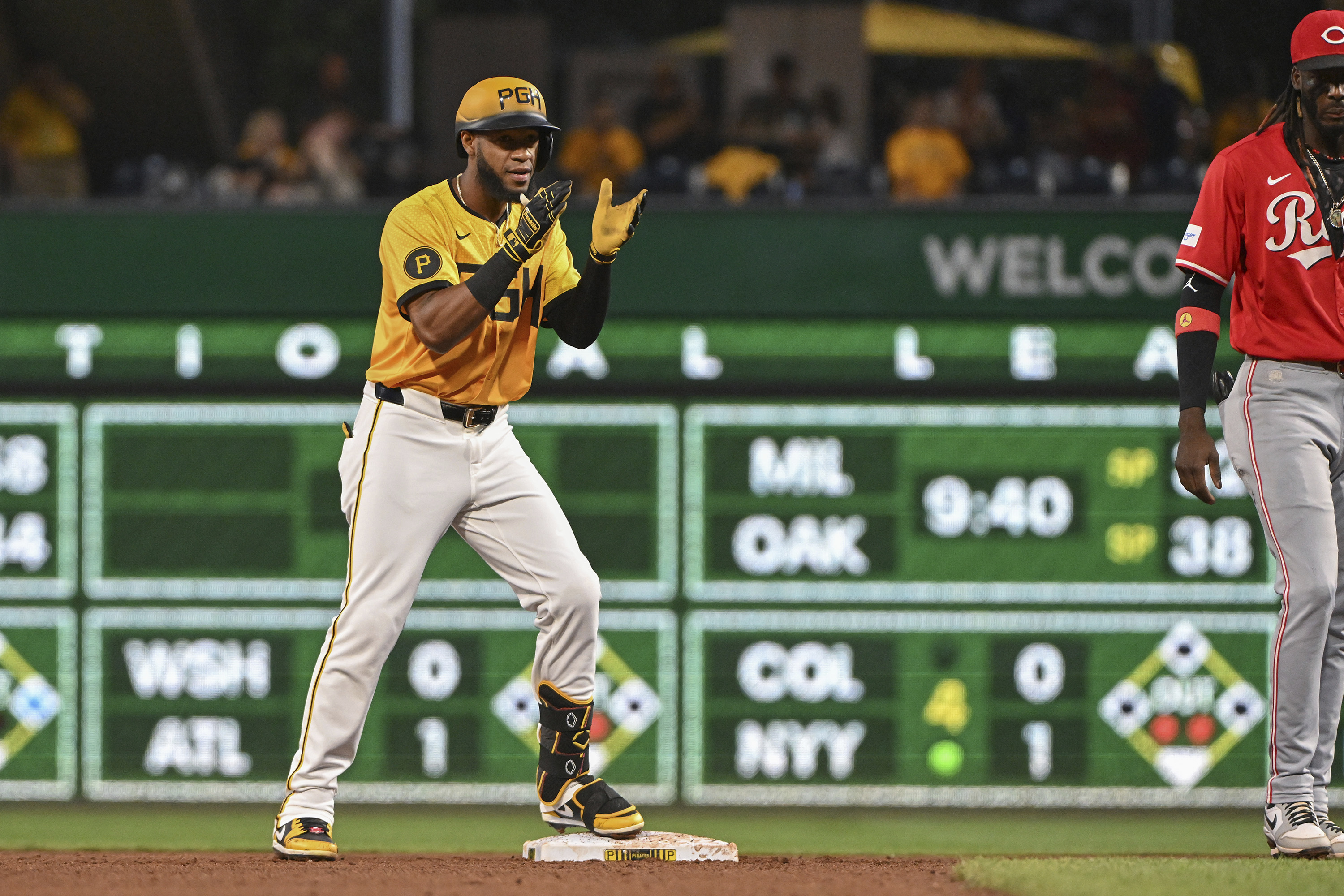Pittsburgh Pirates outfielder Bryan De La Cruz celebrates after driving in a run against the Cincinnati Reds in the fifth inning of a baseball game, Friday, Aug. 23, 2024, in Pittsburgh.