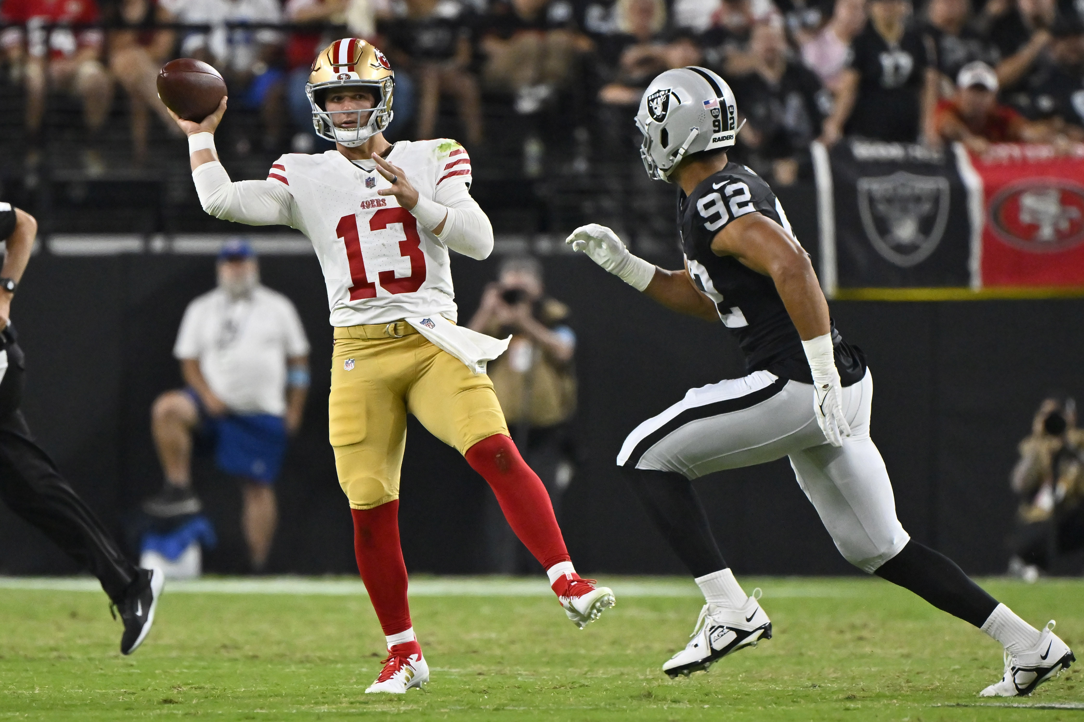 San Francisco 49ers quarterback Brock Purdy (13) throws against the Las Vegas Raiders during the first half of an NFL preseason football game, Friday, Aug. 23, 2024, in Las Vegas. 