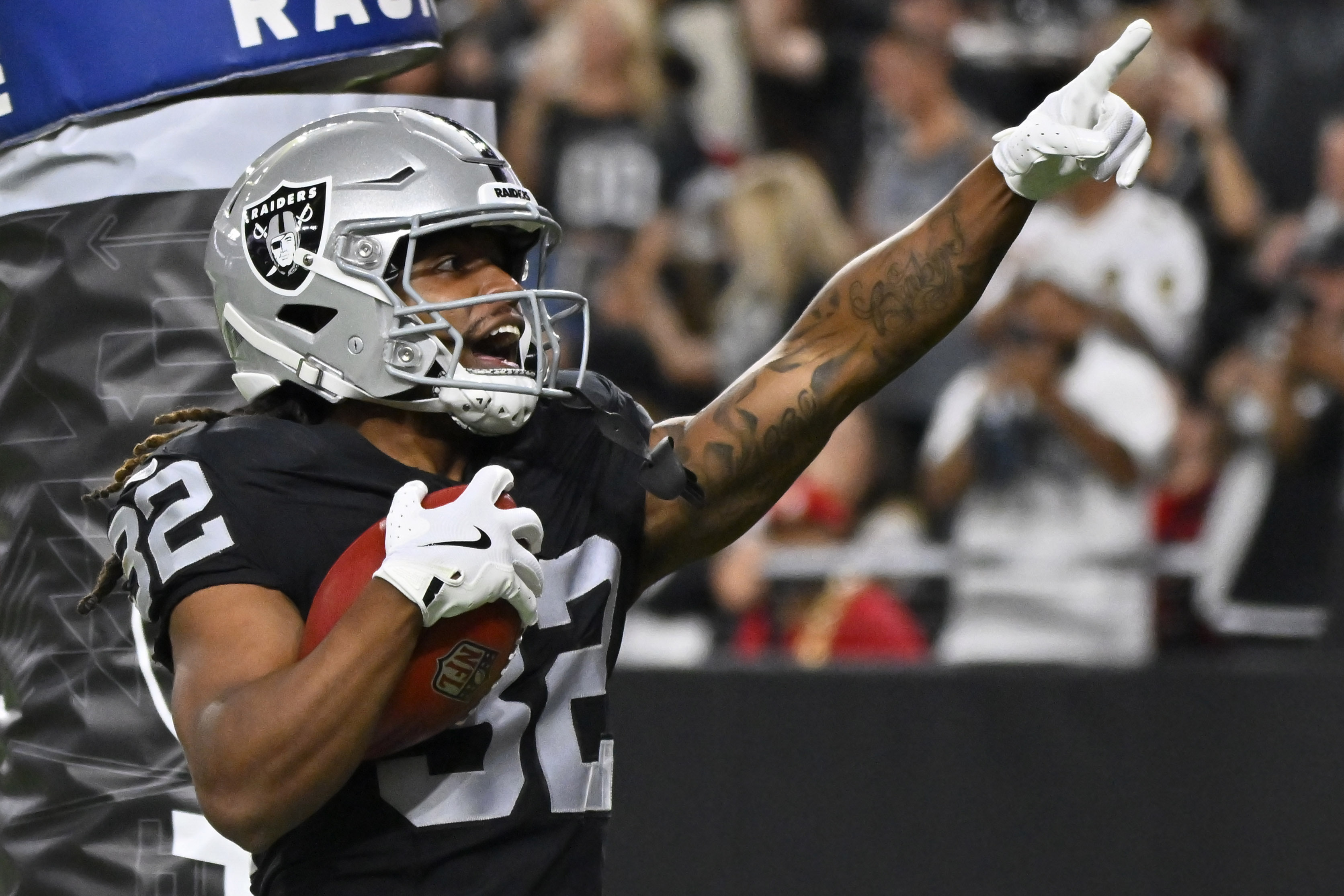 Las Vegas Raiders wide receiver Tyreik McAllister (32) celebrates after returning a punt for a touchdown against the San Francisco 49ers during the first half of an NFL preseason football game, Friday, Aug. 23, 2024, in Las Vegas.