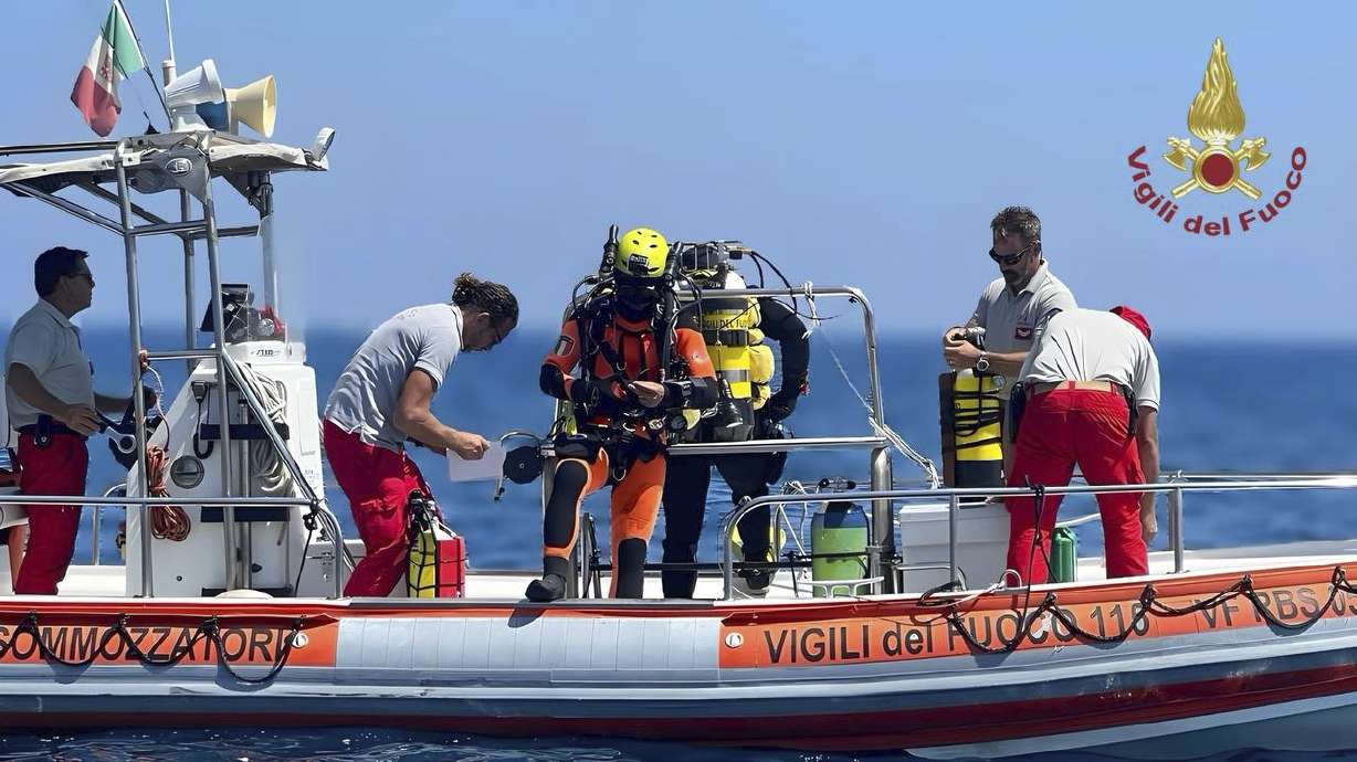 This picture released by the Italian Firefighters on Friday, shows a firefighter cave diver as he prepares to reach the wrecked luxury superyacht Bayesian that sunk early Monday off the Sicilian coast in Porticciolo, in southern Italy.