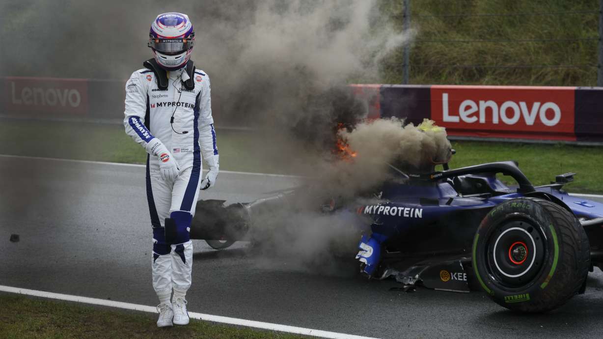 Williams driver Logan Sargeant of the US walks away from his car after he crashed during the third free practice ahead of the Formula One Dutch Grand Prix race at the Zandvoort racetrack, Netherlands, Saturday, Aug. 24, 2024.
