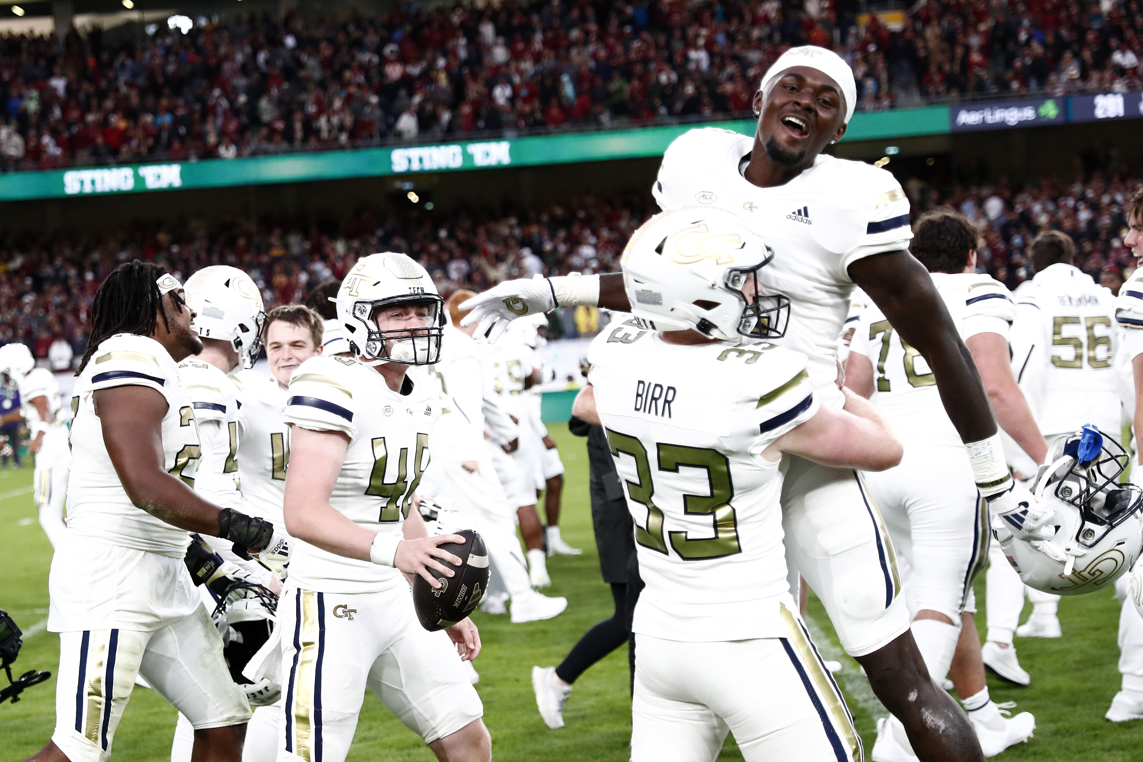 Georgia players celebrate after the NCAA college football game between Georgia Tech and Florida State at the Aviva stadium in Dublin, Saturday, Aug. 24, 2024. 