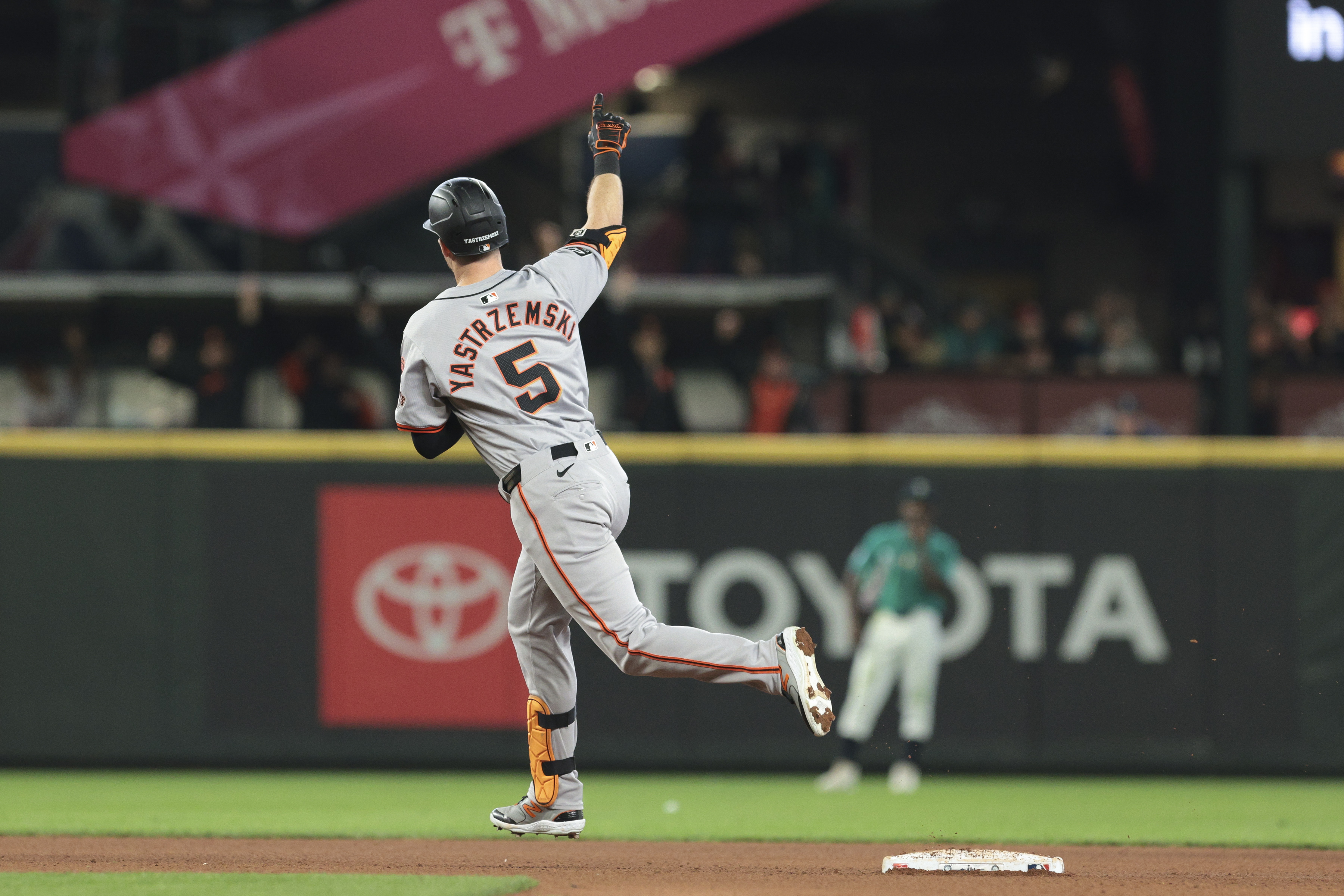 San Francisco Giants' Mike Yastrzemski (5) jogs the bases after hitting a solo home run off Seattle Mariners pitcher Austin Voth during the seventh inning of a baseball game, Saturday, Aug. 24, 2024, in Seattle. 