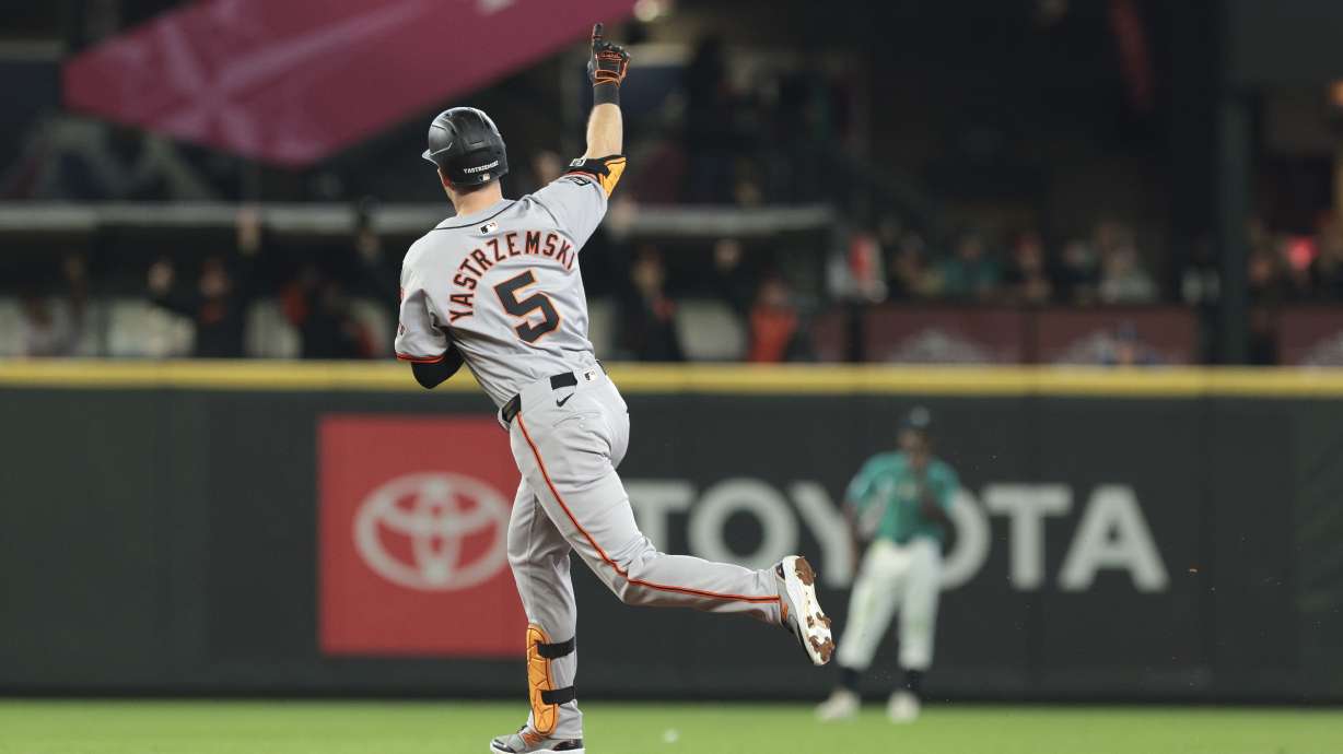 San Francisco Giants' Mike Yastrzemski (5) jogs the bases after hitting a solo home run off Seattle Mariners pitcher Austin Voth during the seventh inning of a baseball game, Saturday, Aug. 24, 2024, in Seattle.