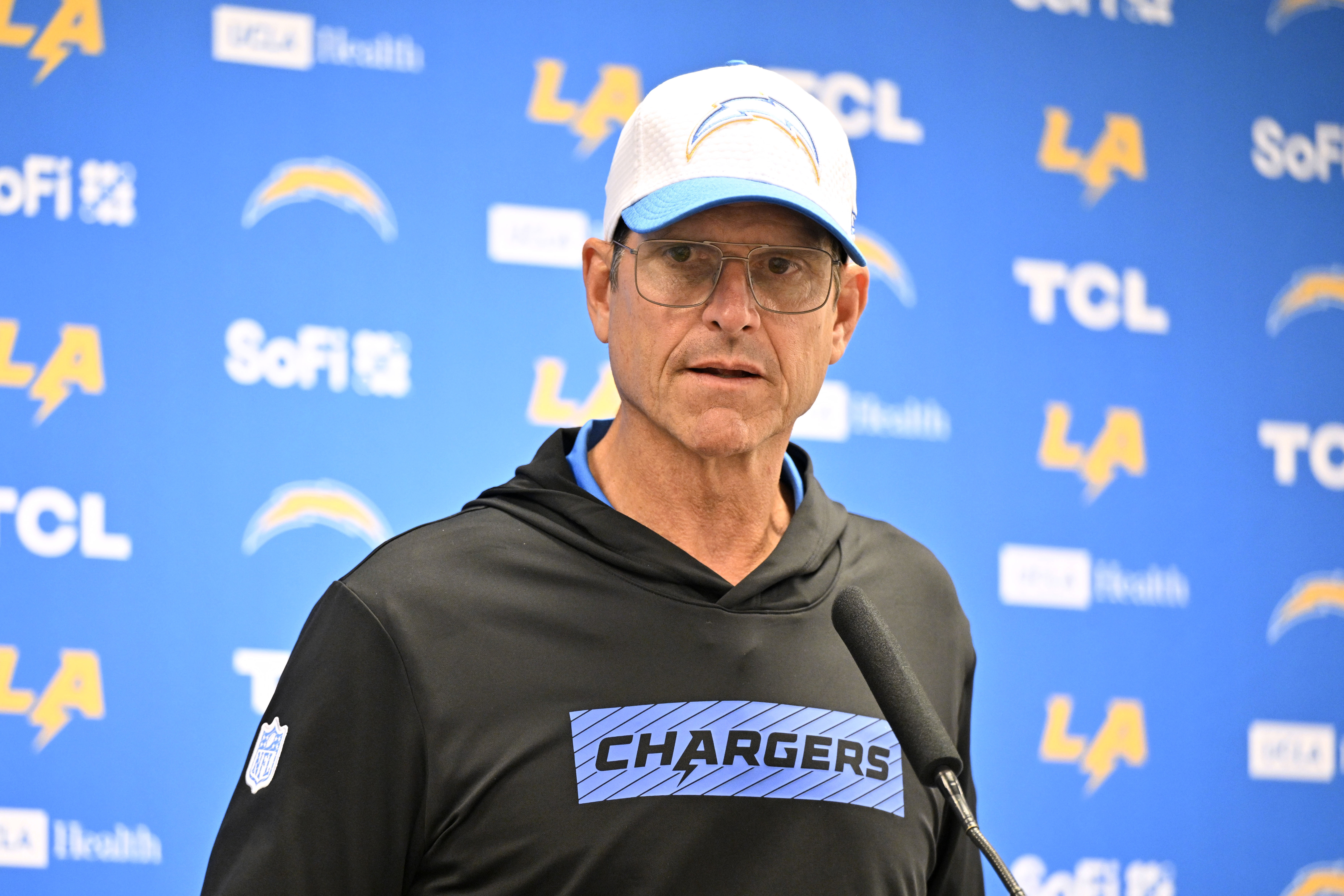 Los Angeles Chargers head coach Jim Harbaugh responds to questions during a news conference after the team's preseason NFL football game against the Dallas Cowboys, Saturday, Aug. 24, 2024, in Arlington, Texas. 