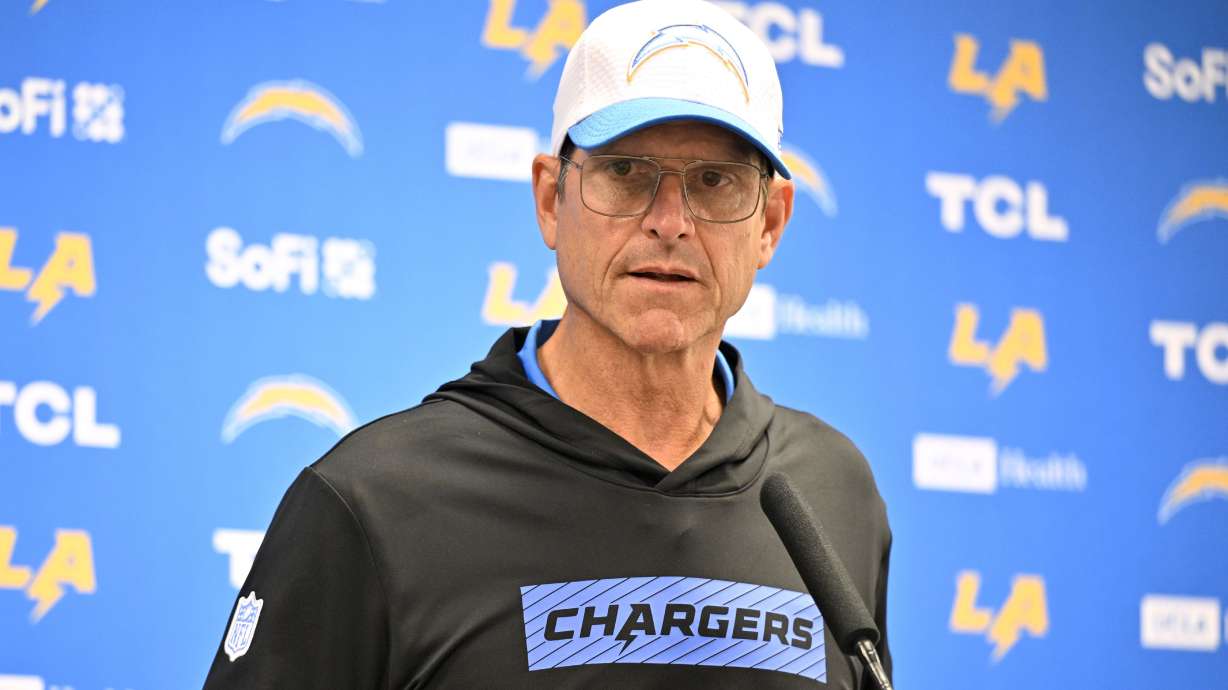 Los Angeles Chargers head coach Jim Harbaugh responds to questions during a news conference after the team's preseason NFL football game against the Dallas Cowboys, Saturday, Aug. 24, 2024, in Arlington, Texas.