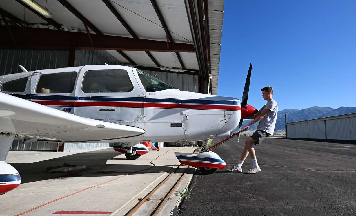 Mason Bingham, a student at Box Elder High, who is training to become a pilot through Utah State University’s Private Pilot Ground School program, pulls the plane out prior to his flight with his father, Jason Bingham, who is also his instructor. The two flew over the Brigham City area on Friday, Aug. 16.