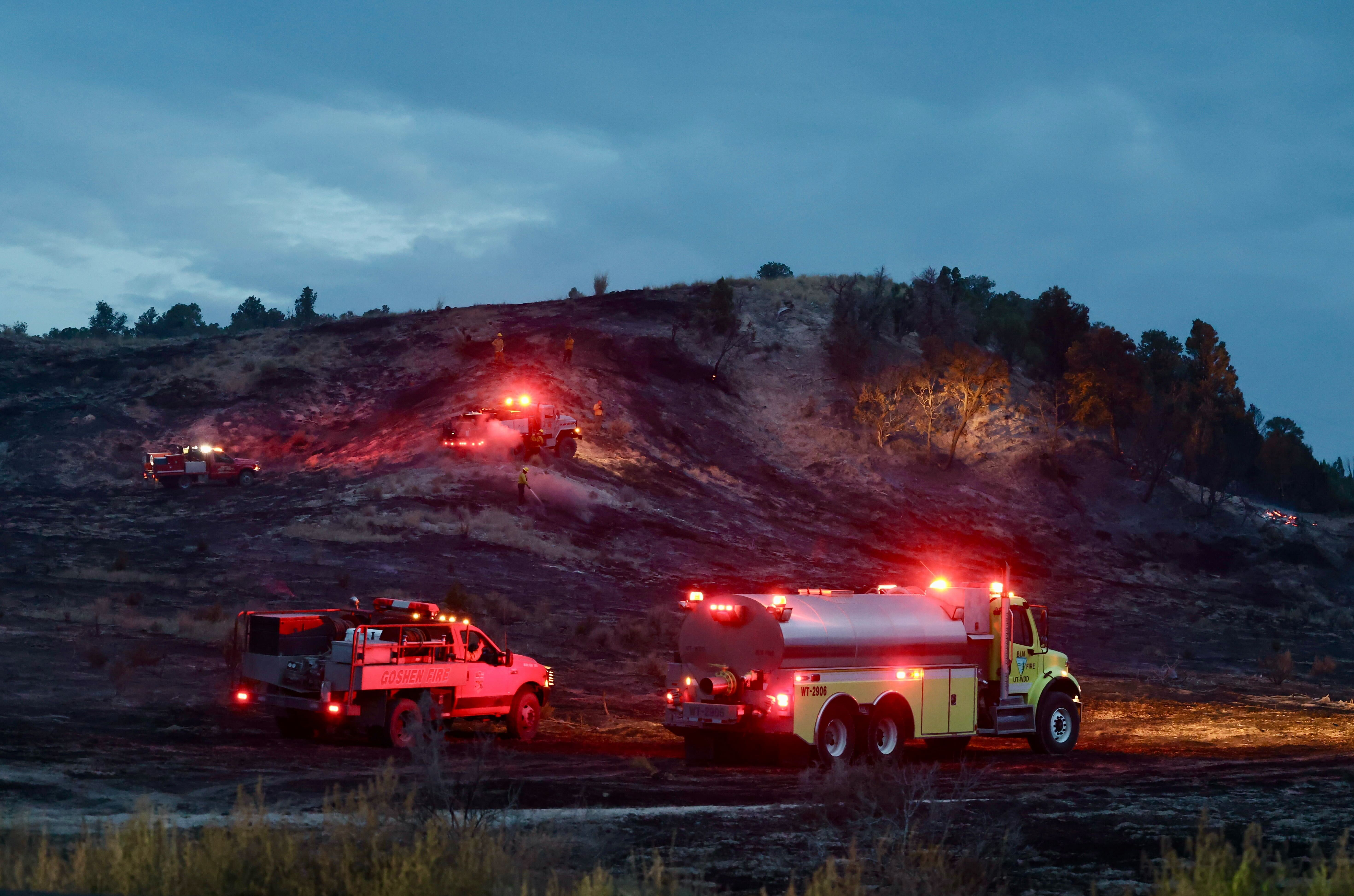 Firefighters put out hot spots on the Boulter Fire along State Route 36 west of Eureka in Tooele County on Saturday. Sunday the fire was mapped at 2,300 acres.