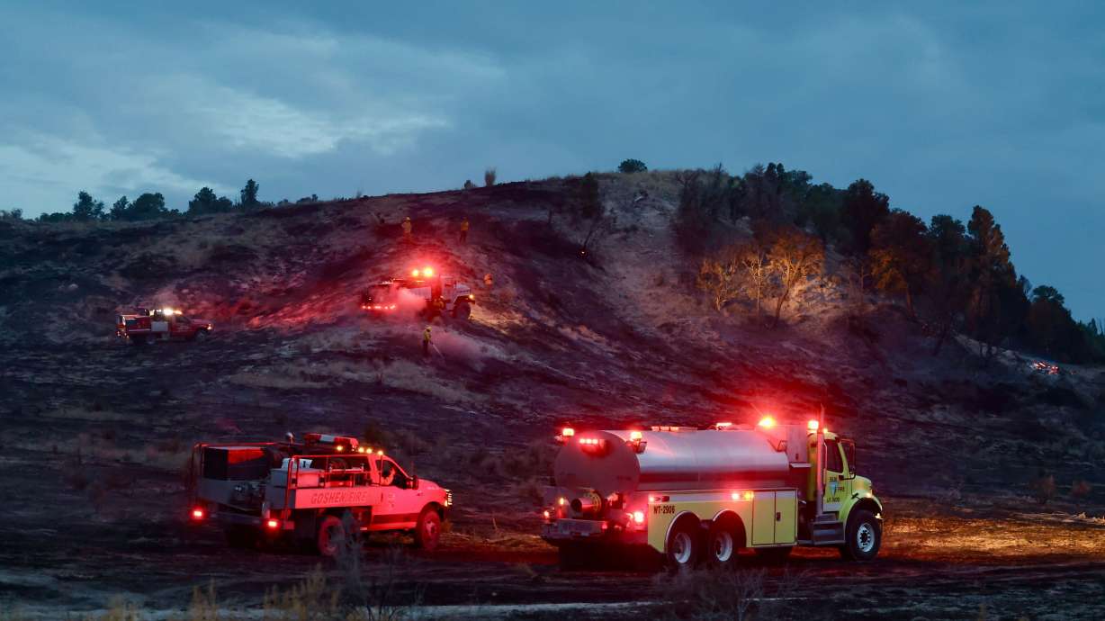 Firefighters put out hot spots on the Boulter Fire along State Route 36 west of Eureka in Tooele County on Saturday. Sunday the fire was mapped at 2,300 acres.