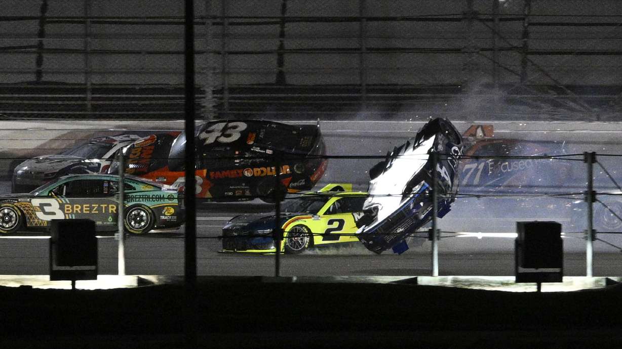 Josh Berry (4) flips his car after getting involved in a multi-car collision on the back stretch during a NASCAR Cup Series auto race at Daytona International Speedway, Saturday, Aug. 24, 2024, in Daytona Beach, Fla.