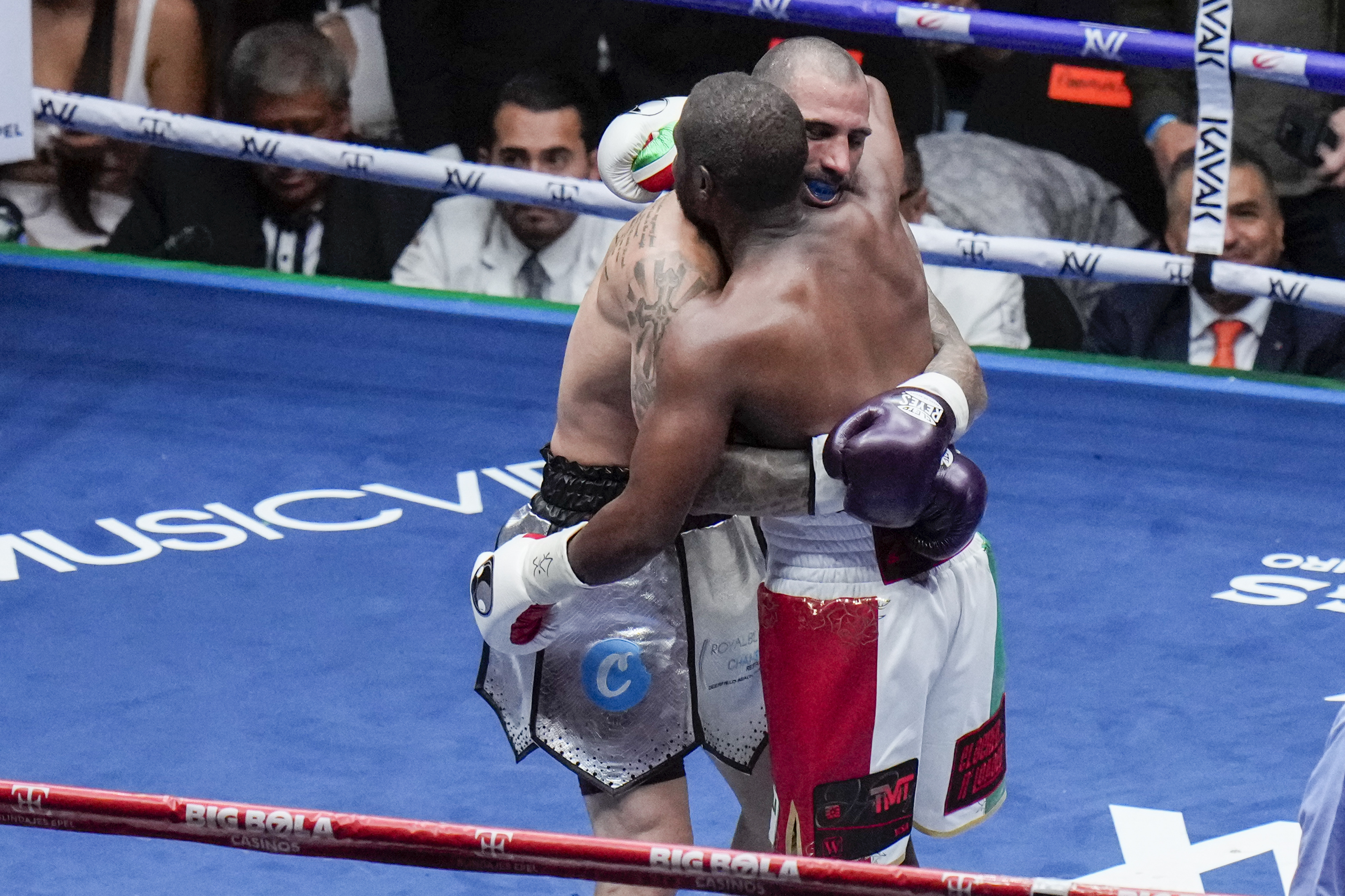 Floyd Mayweather, front, and John Gotti III embrace at the end of an exhibition boxing match at the Arena Mexico in Mexico City, Saturday, Aug. 24, 2024.