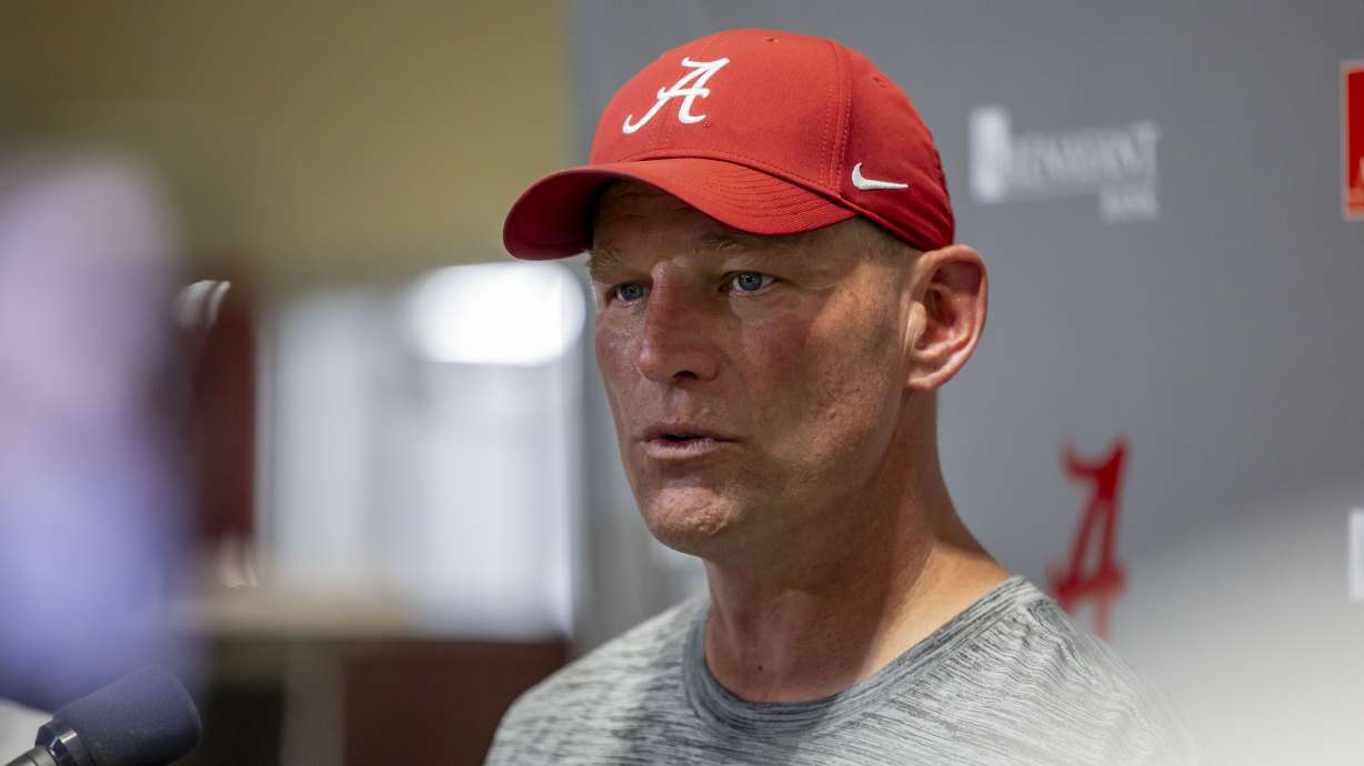 Alabama head coach Kalen DeBoer talks with the media following NCAA college football practice, Wednesday, July 31, 2024, in Tuscaloosa, Ala.