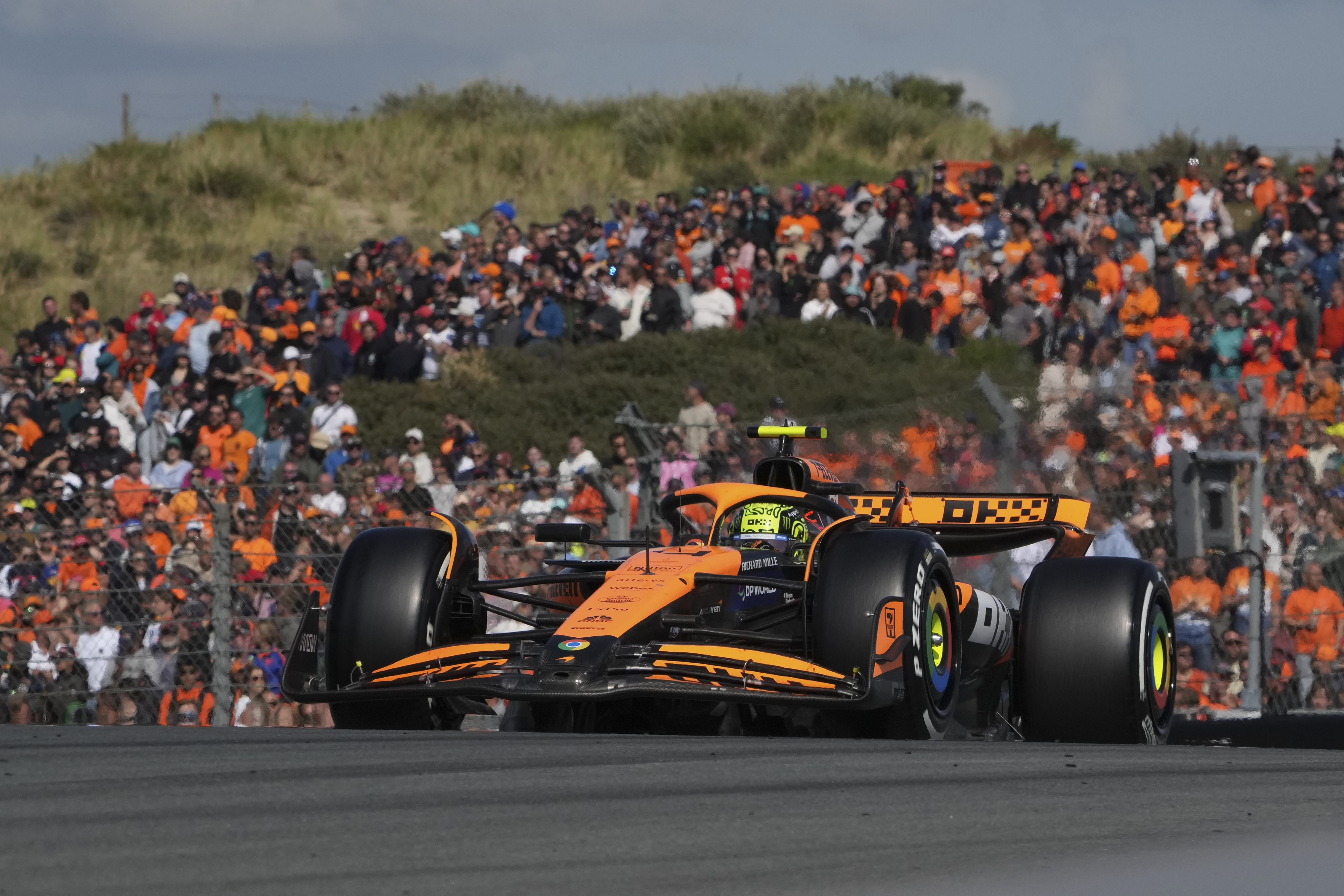 McLaren driver Lando Norris of Britain steers his car during the Formula One Dutch Grand Prix race at the Zandvoort racetrack, Netherlands, Sunday, Aug. 25, 2024.