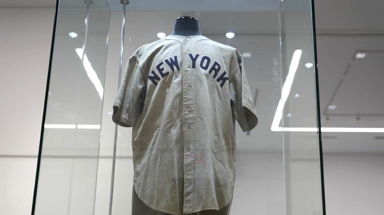 The 1932 Babe Ruth game worn New York Yankees World Series "Called Shot" jersey is displayed in a sealed glass box at Heritage Auction in Irving, Texas, Wednesday, Aug. 21, 2024.
