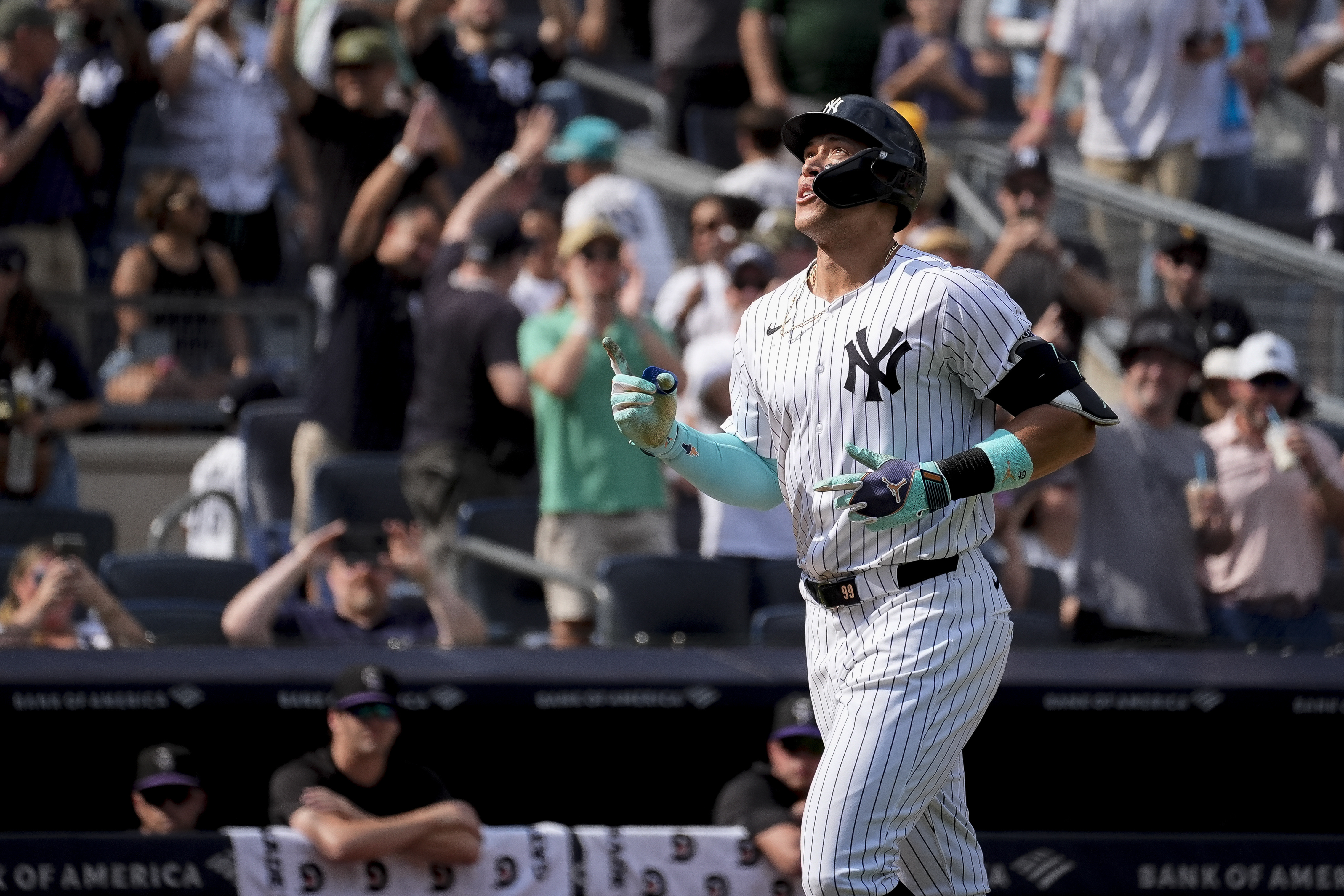 New York Yankees' Aaron Judge crosses home plate after hitting a home run during the seventh inning of a baseball game against the Colorado Rockies, Sunday, Aug. 25, 2024, in New York.