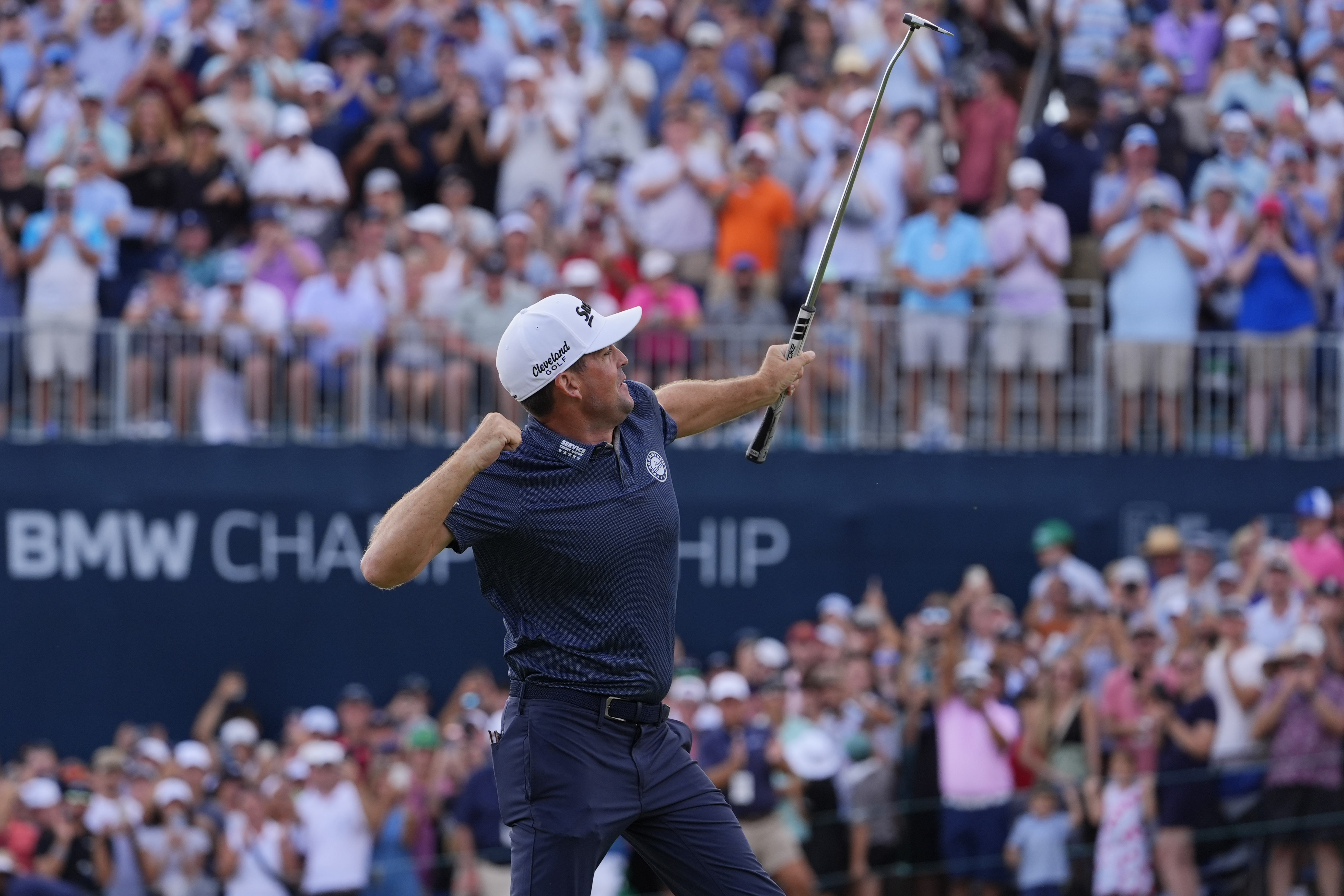 Keegan Bradley celebrates on the 18th green after winning the BMW Championship golf event at Castle Pines Golf Club, Sunday, Aug. 25, 2024, in Castle Rock, Colo. 