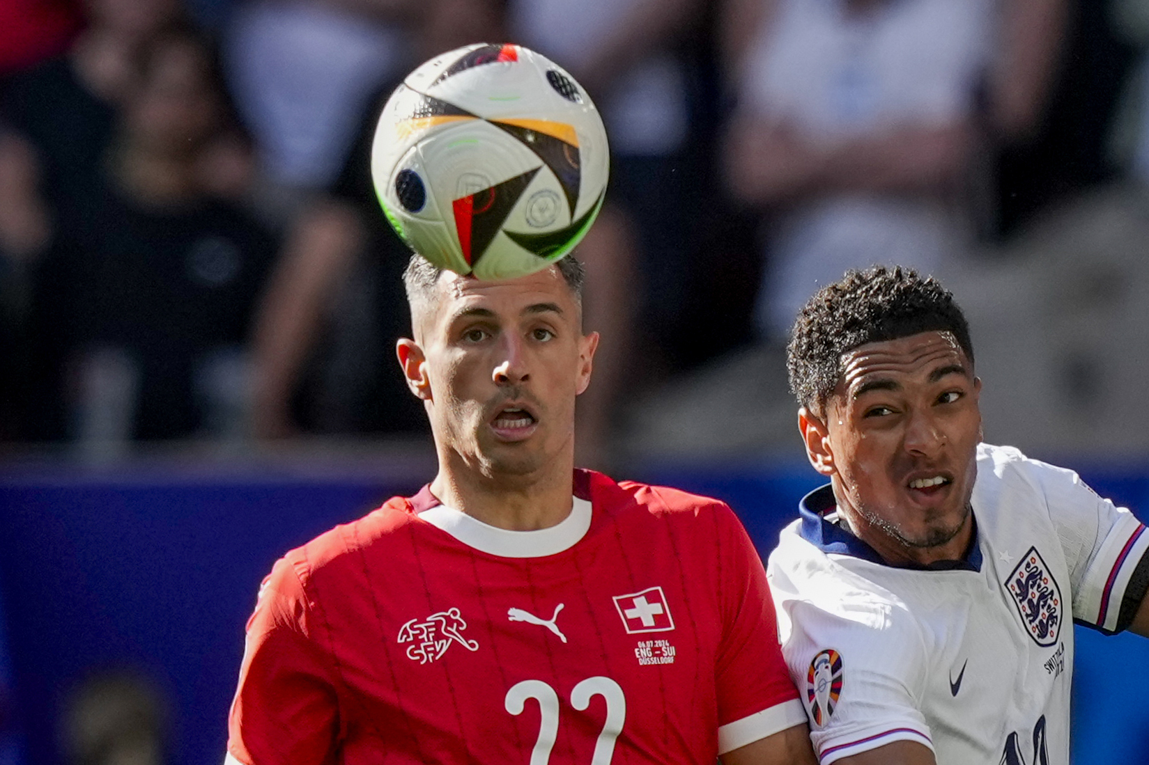 FILE - Switzerland's Fabian Schar, left, vies for the ball with England's Jude Bellingham during the quarterfinal soccer match between England and Switzerland at the Euro 2024 soccer tournament in Duesseldorf, Germany, Saturday, July 6, 2024. 