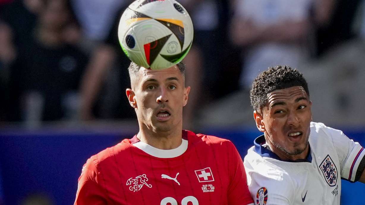 FILE - Switzerland's Fabian Schar, left, vies for the ball with England's Jude Bellingham during the quarterfinal soccer match between England and Switzerland at the Euro 2024 soccer tournament in Duesseldorf, Germany, Saturday, July 6, 2024.