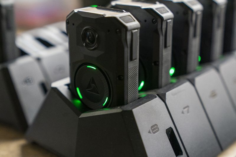 Axon body cameras charge on a docking station at Oklahoma City police headquarters on May 31 in Oklahoma City, Okla.