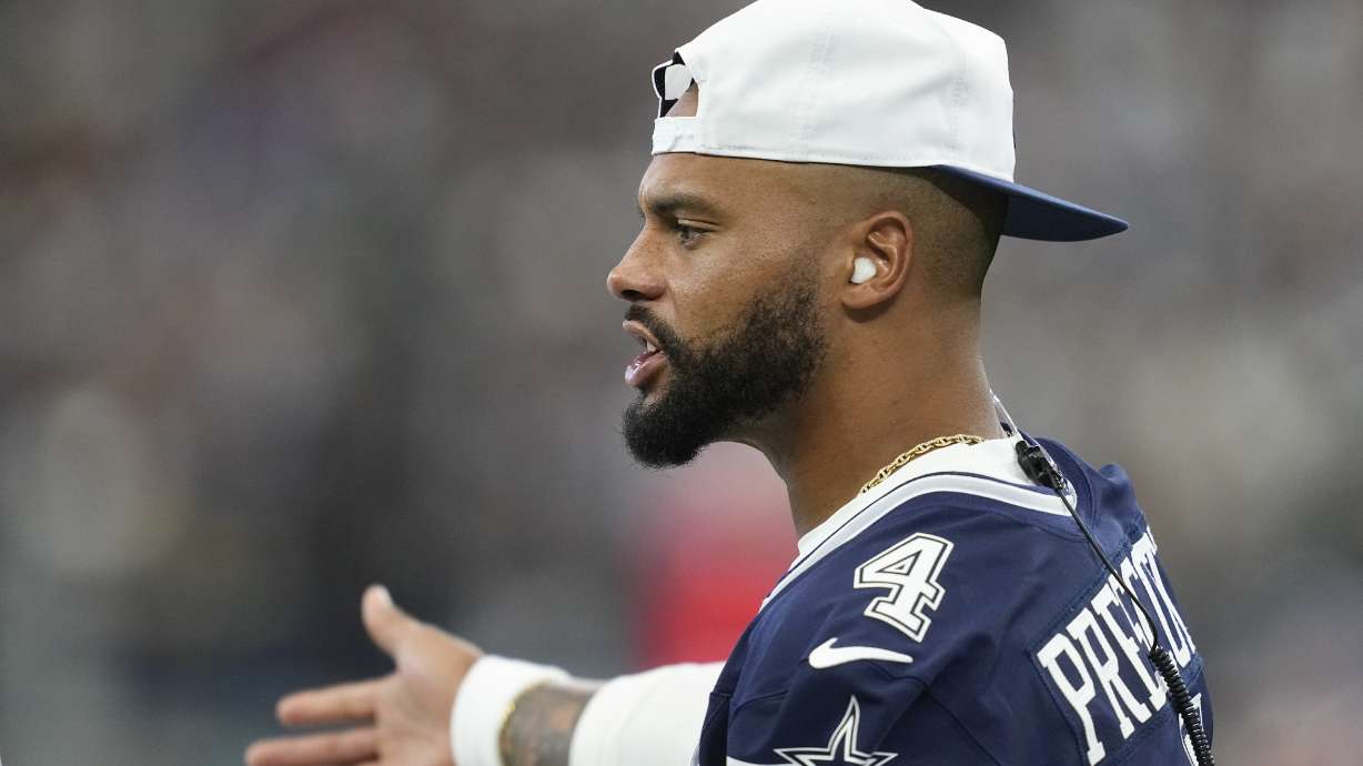 Dallas Cowboys quarterback Dak Prescott stands on the sideline during the first half of a preseason NFL football game against the Los Angeles Chargers, Saturday, Aug. 24, 2024, in Arlington, Texas.