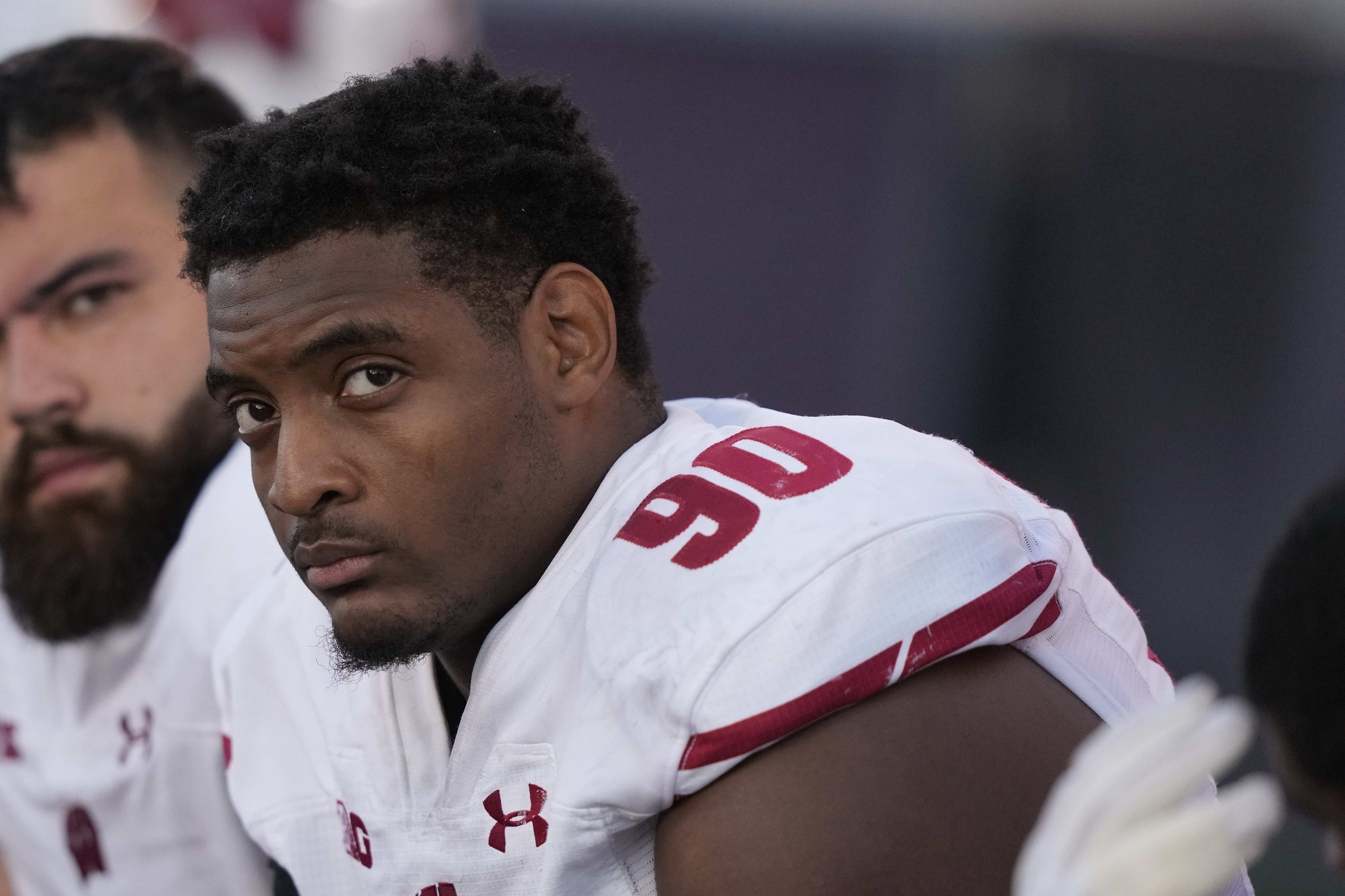 FILE - Wisconsin defensive end James Thompson Jr. looks at the scoreboard during an NCAA college football game against Illinois,, Oct. 21, 2023, in Champaign, Ill. 