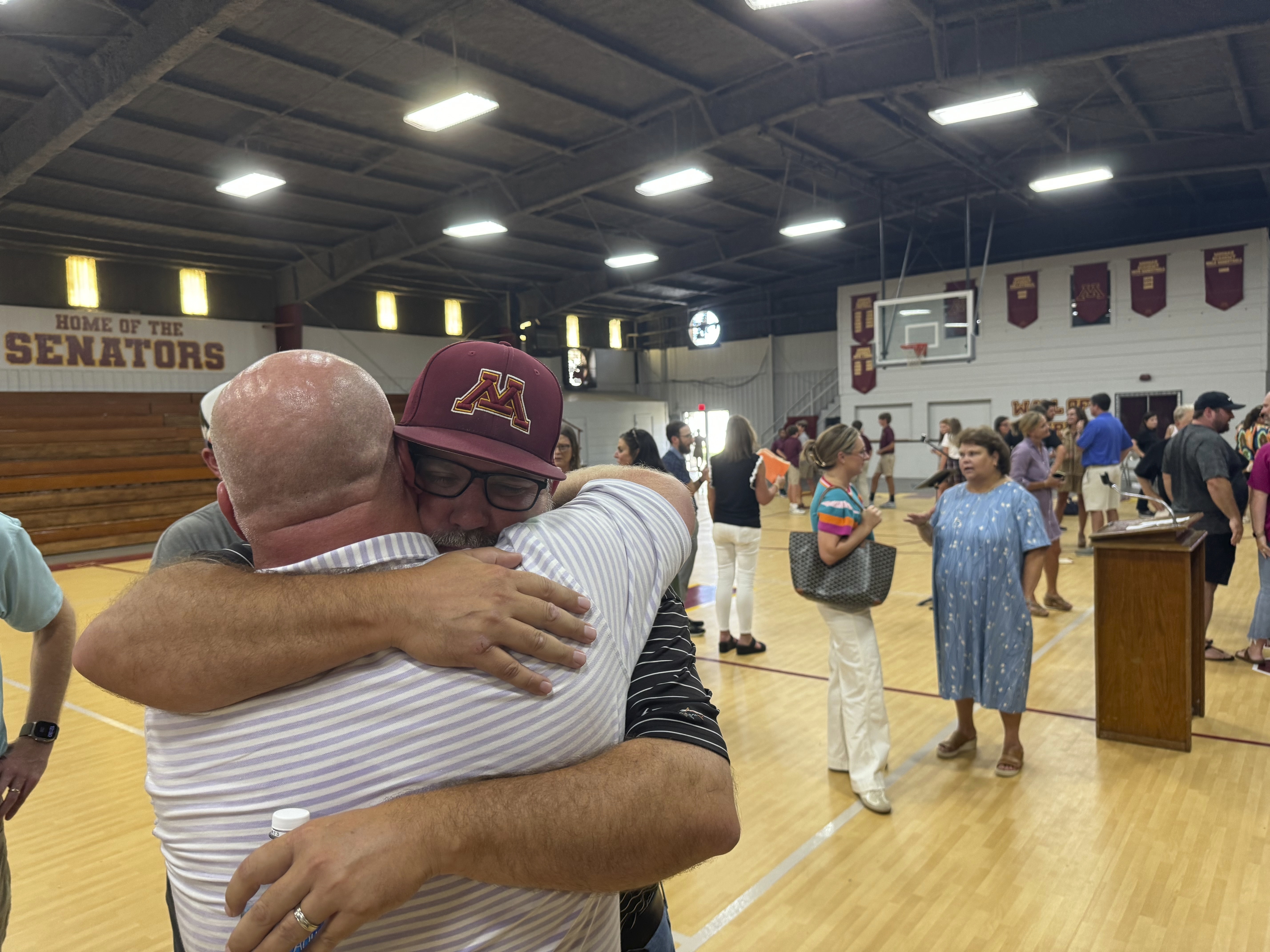Jamie Tellier, father of Caden Tellier, hugs a student after a memorial service for Tellier's son in Selma, Ala., Monday, Aug. 26, 2024. 