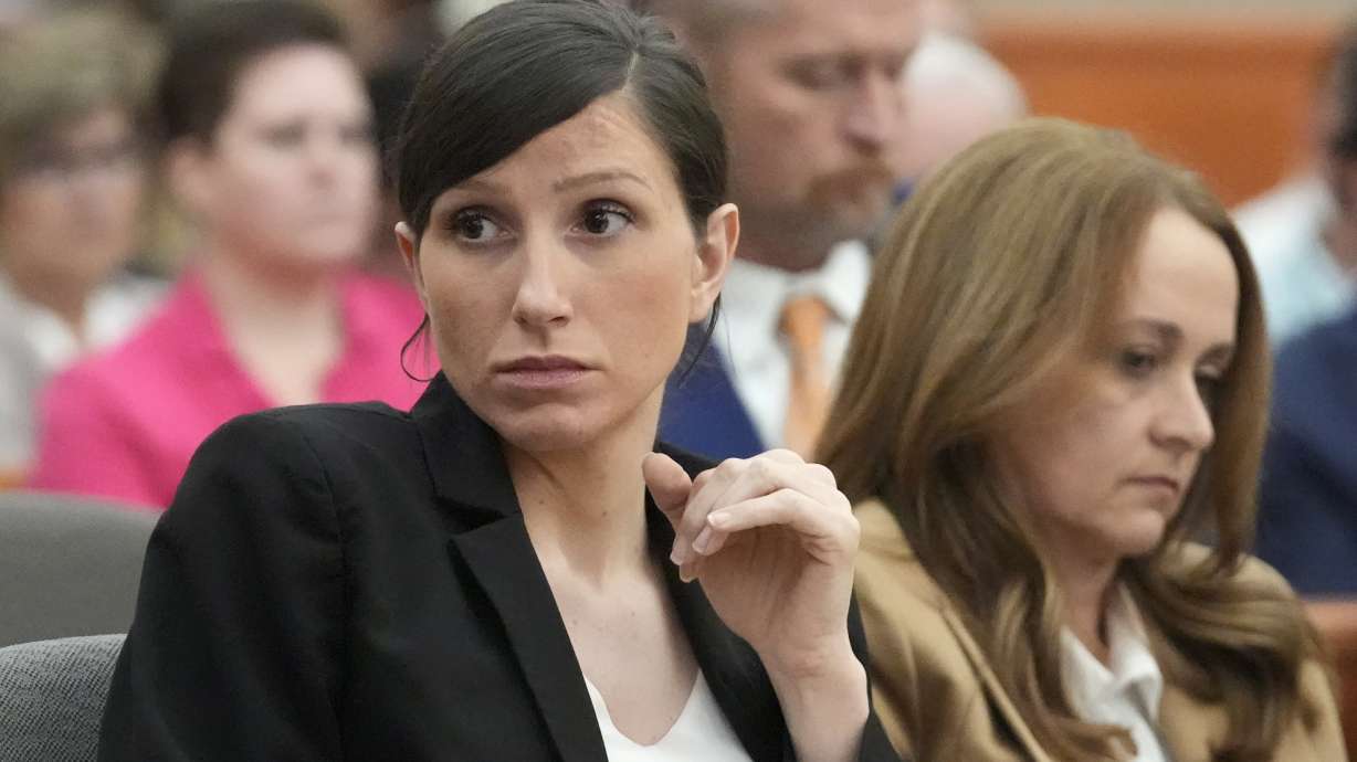 Kouri Richins, a Utah mother of three who wrote a children's book about coping with grief after her husband's death and was later accused of fatally poisoning him, looks on during a hearing Monday.