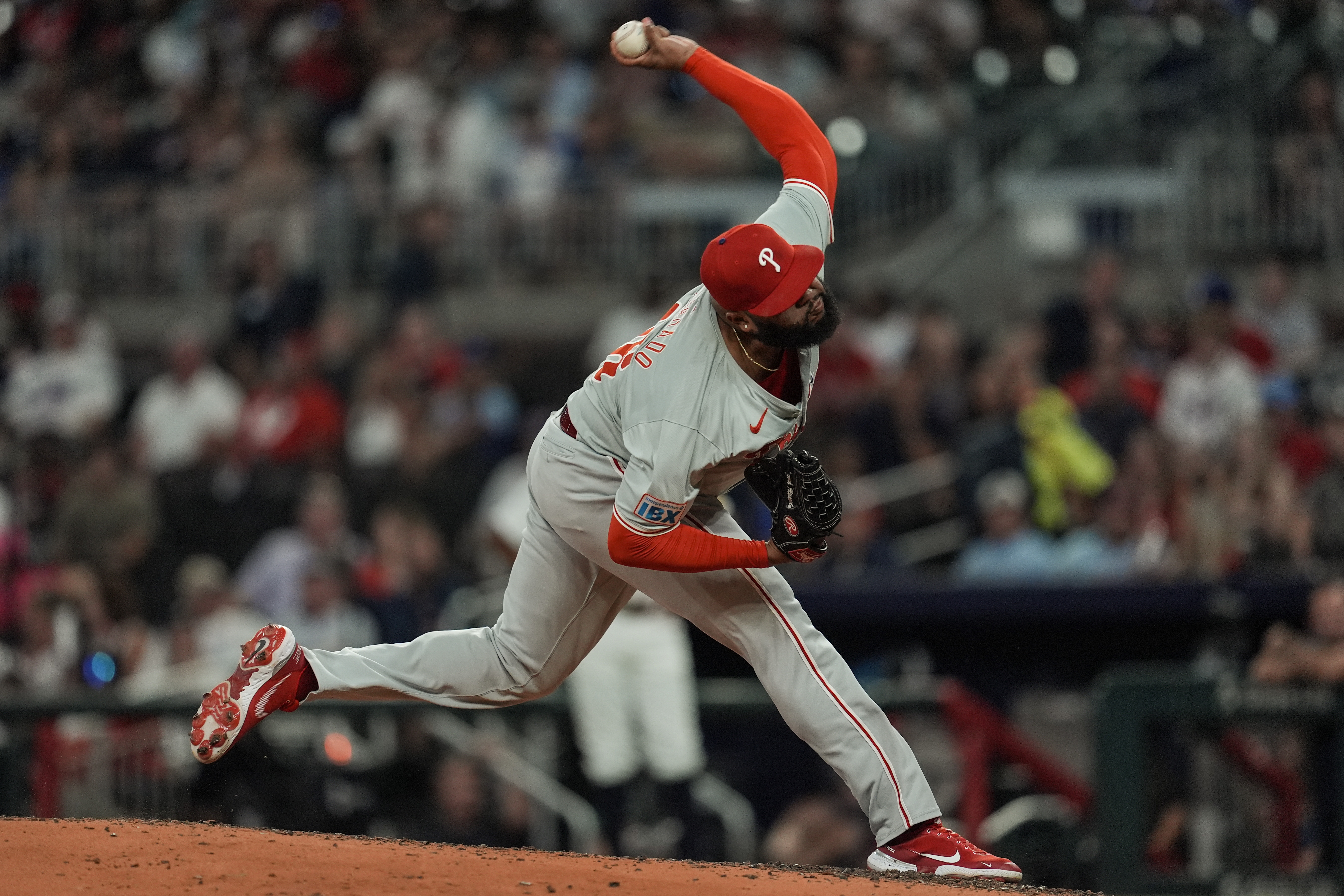 Philadelphia Phillies pitcher José Alvarado (46) delivers against the Atlanta Braves in the eighth inning of a baseball game, Tuesday, Aug. 20, 2024, in Atlanta. 