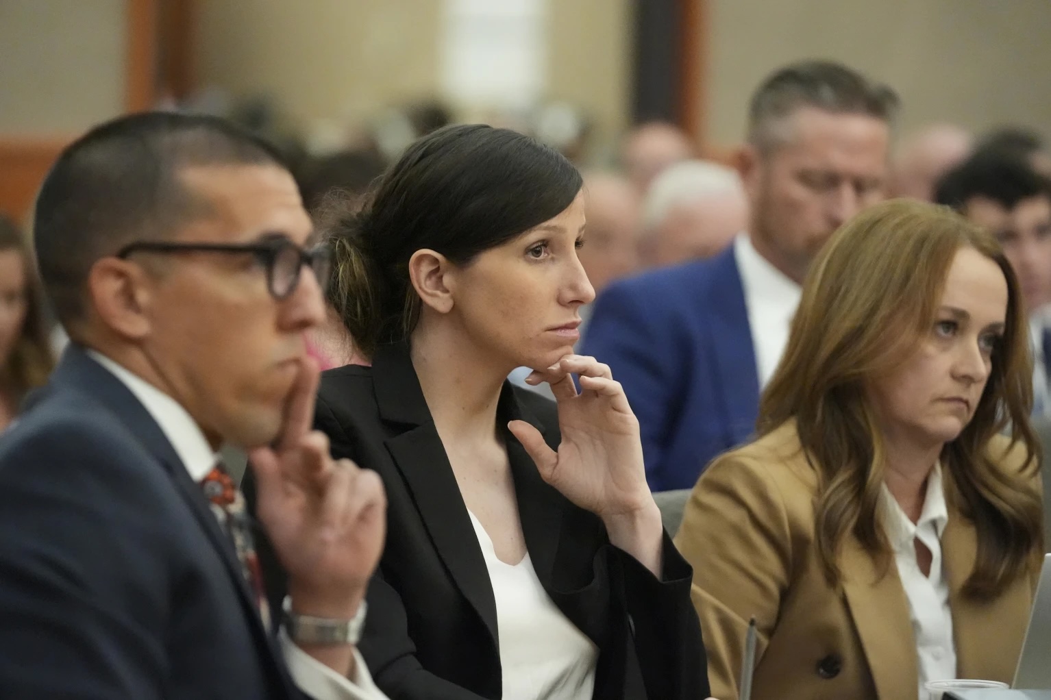 Kouri Richins, a Kamas mother who wrote a children's book about coping with grief after her husband's death and was later accused of fatally poisoning him, looks on during a hearing on Aug. 26.