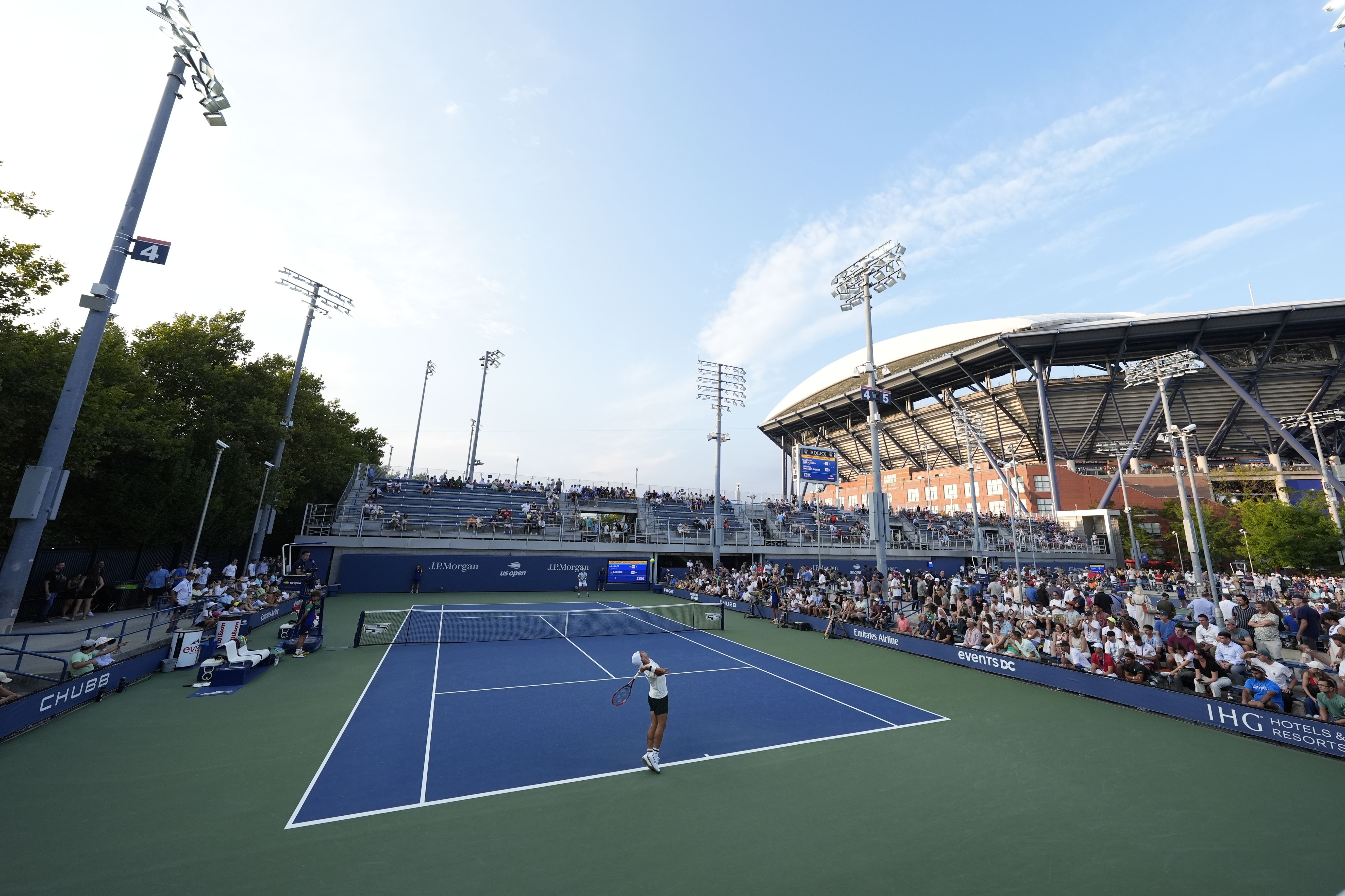 Sebastian Baez, of Argentina, serves to Luciano Darderi, of Italy, during a first round match of the U.S. Open tennis championships, Monday, Aug. 26, 2024, in New York. 