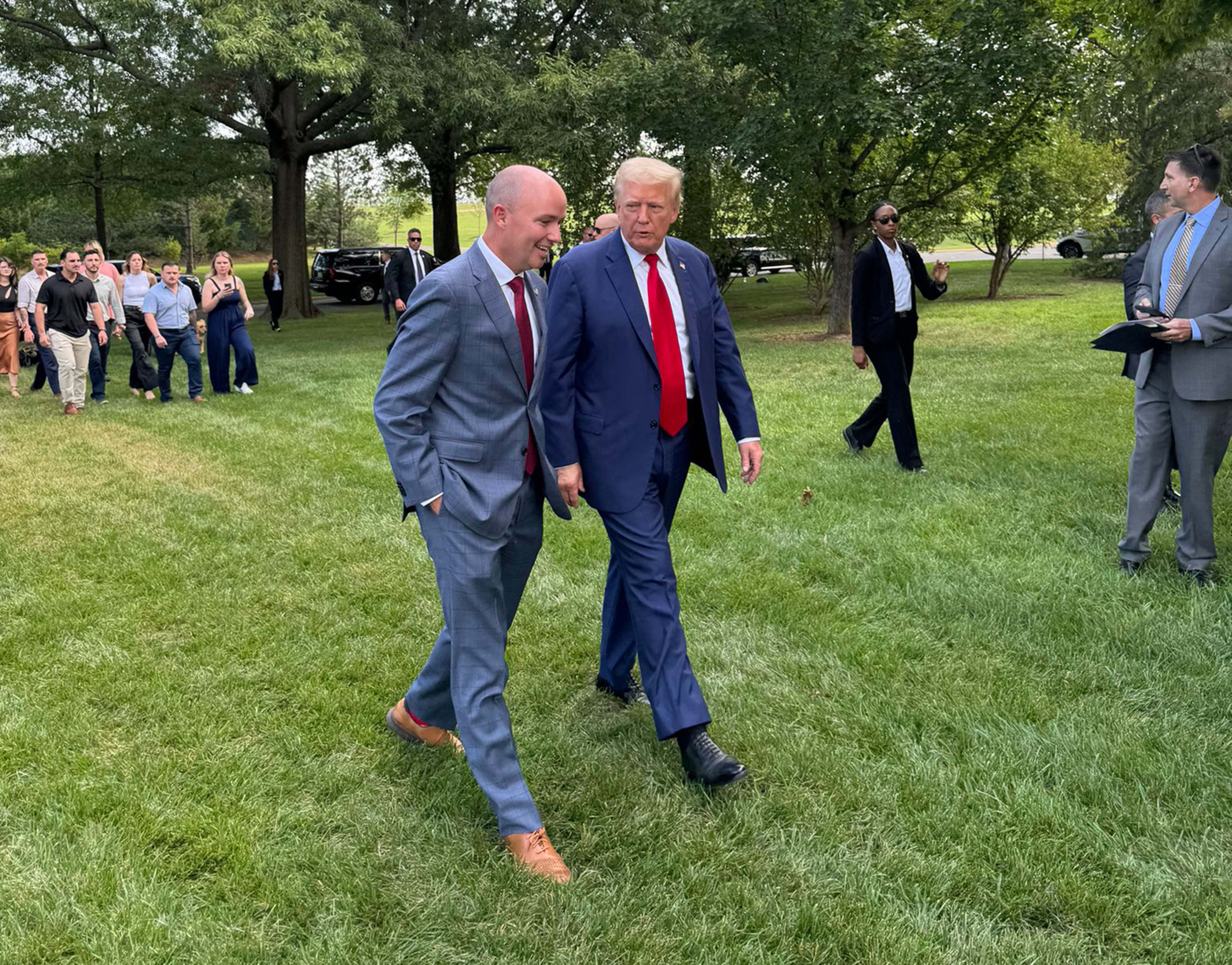 Gov. Spencer Cox walks with former President Donald Trump during a press event at Arlington National Cemetery, Monday, in Arlington, Va. A majority of Utah voters said they approve of Cox's endorsement of Trump.