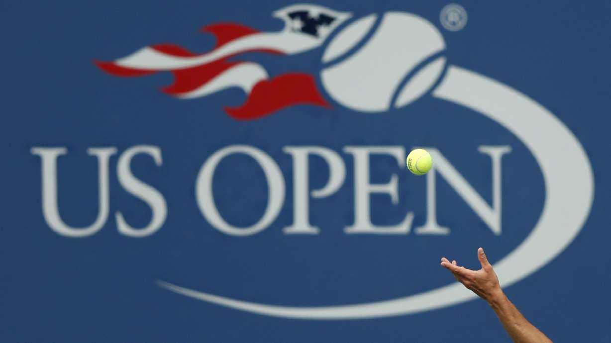 FILE - Philipp Kohlschreiber, of Germany, serves to John Millman, of Australia, during the third round of the U.S. Open tennis tournament in New York, Sept. 2, 2017. The 2024 U.S. Open begins Monday, Aug. 26.