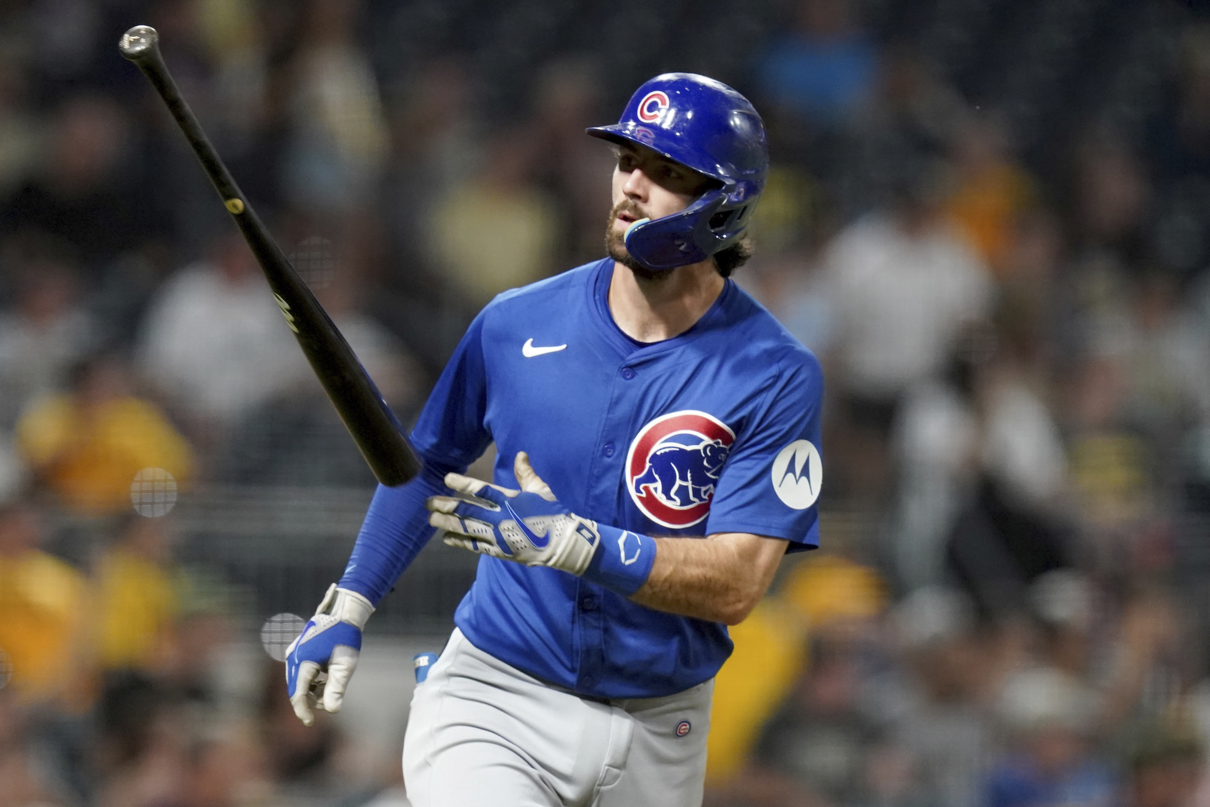 Chicago Cubs' Dansby Swanson tosses his bat after hitting a grand slam during the sixth inning of a baseball game against the Pittsburgh Pirates, Monday, Aug. 26, 2024, in Pittsburgh. 
