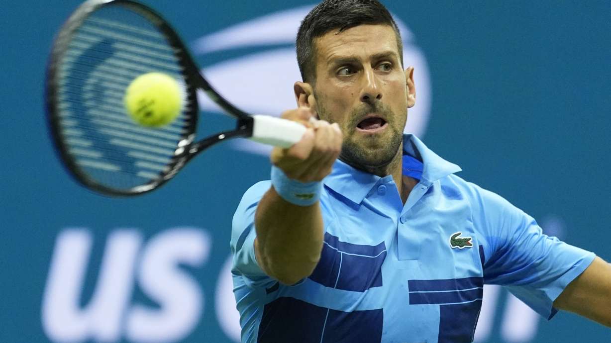 Novak Djokovic, of Serbia, returns a shot to Radu Albot, of Moldova, during a first round match of the U.S. Open tennis championships, Monday, Aug. 26, 2024, in New York.