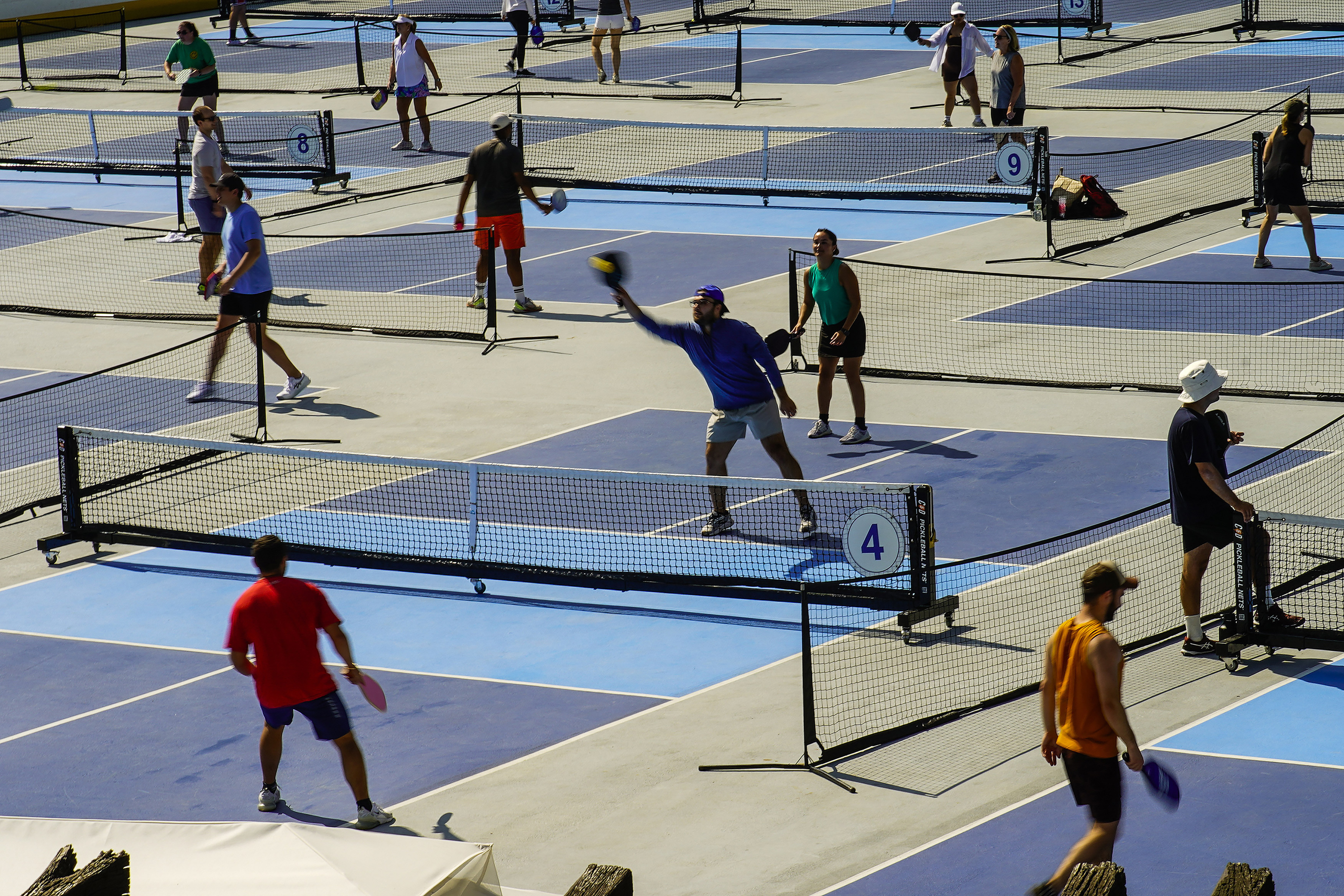 People practice pickleball on the courts of CityPickle at Central Park's Wollman Rink, Aug. 24 in New York. A tennis group is taking a new swing at the growth of pickleball in the U.S.